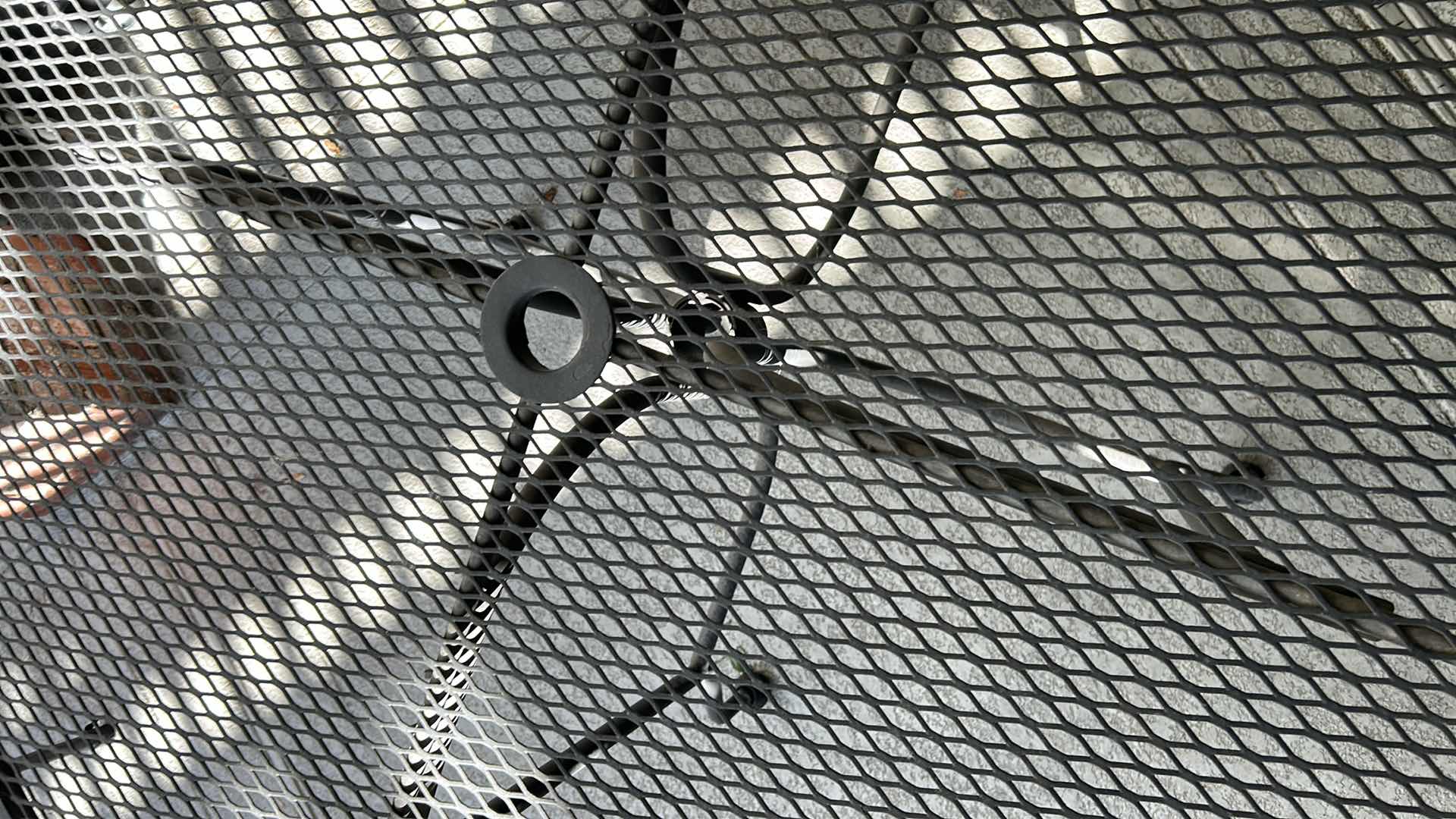 Photo 1 of ROUND BLACK METAL MESH OUTDOOR PATIO TABLE W UMBRELLA HOLE 42"