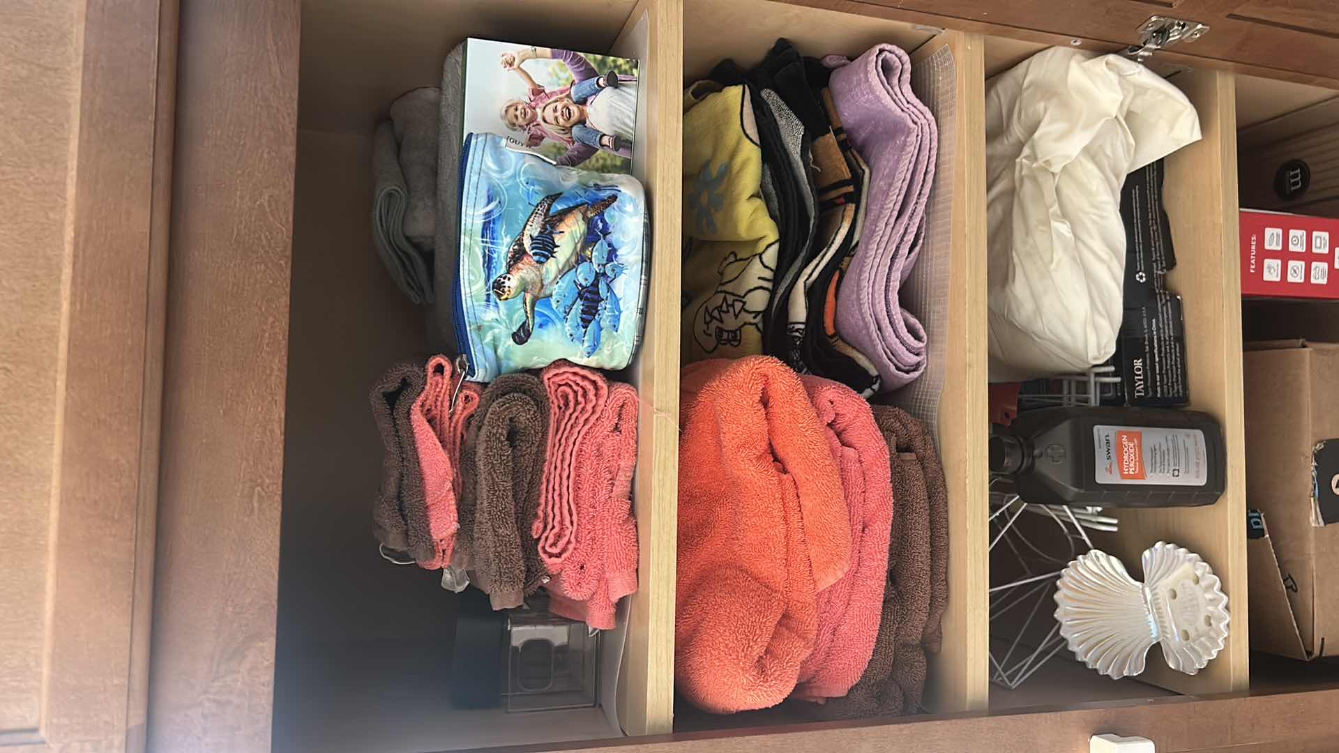 Photo 1 of CONTENTS OF CABINET TOWELS