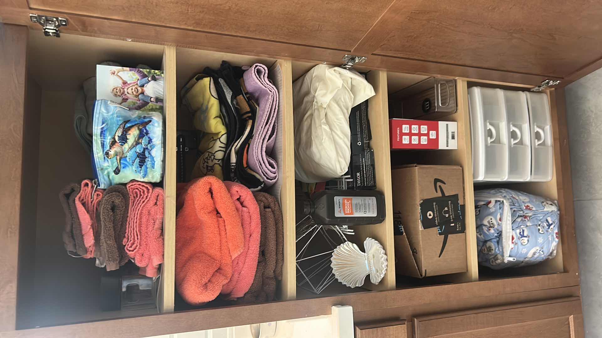 Photo 1 of CONTENTS OF CABINET TOWELS