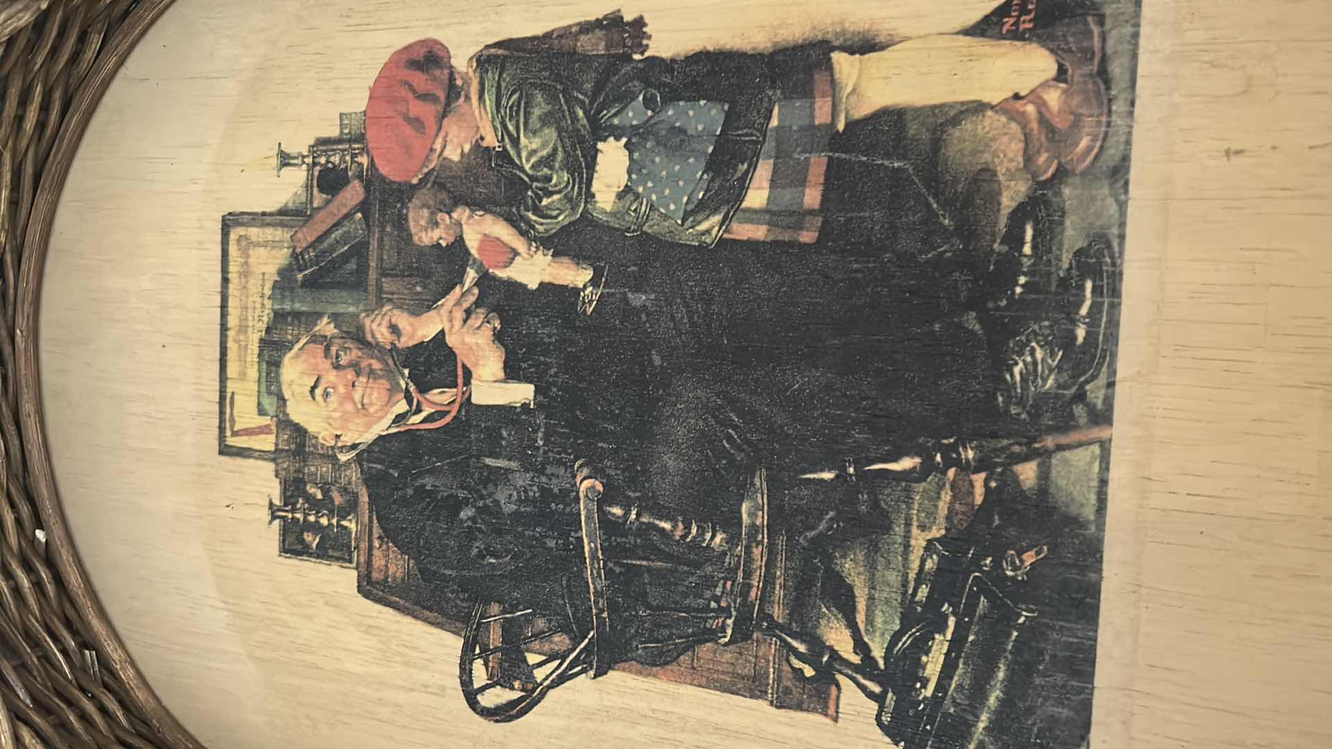 Photo 1 of OVAL BRAIDED WICKER FRAME NORMAN ROCKWELL PRINT "THE DOCTOR AND THE DOLL" 15" X 20"