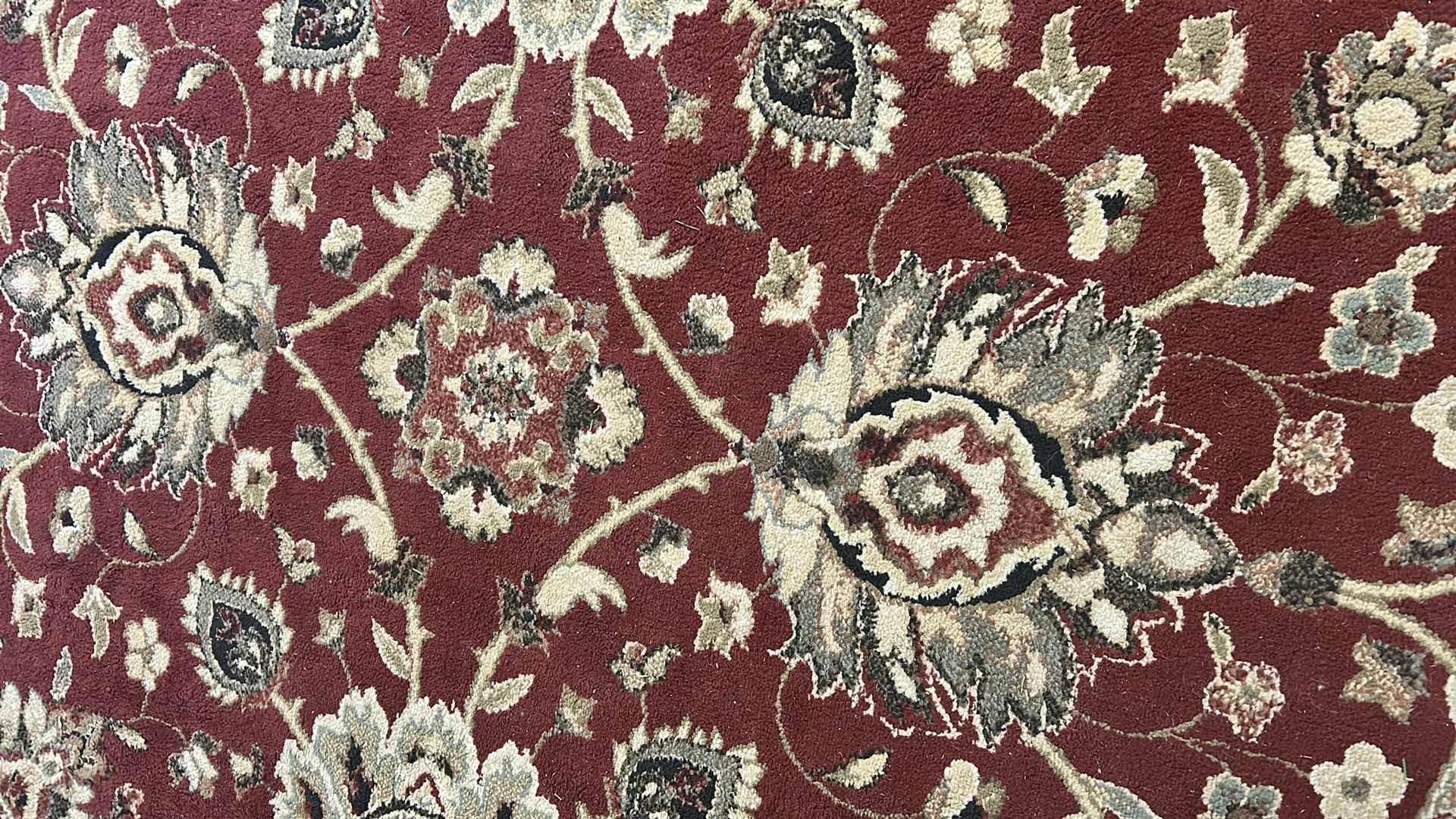 Photo 1 of ORIENTAL WEAVERS RED IVORY POLYPROPYLENE RUG 6FT X 6FT ROUND