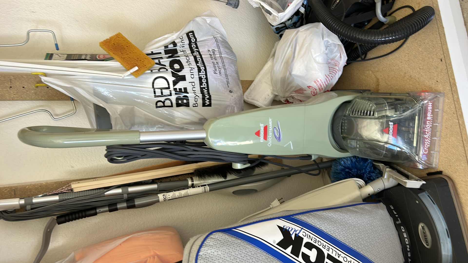Photo 1 of CONTENTS IN CABINET, ORECK VACUUM, FLOOR CLEANER AND MORE