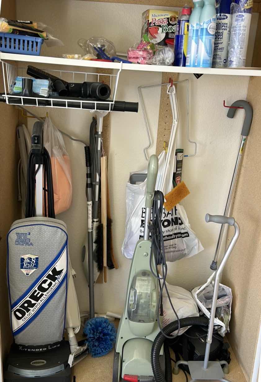 Photo 1 of CONTENTS IN CABINET, ORECK VACUUM, FLOOR CLEANER AND MORE