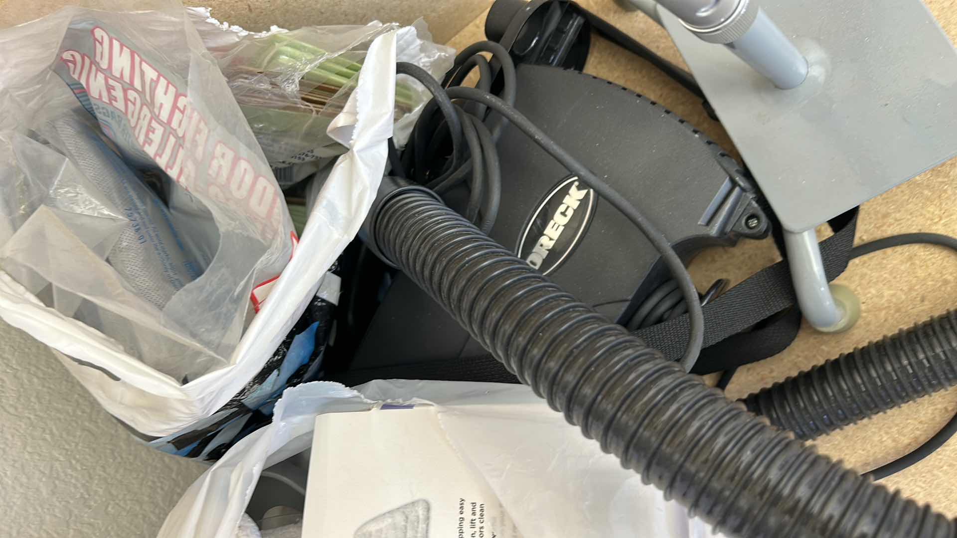 Photo 1 of CONTENTS IN CABINET, ORECK VACUUM, FLOOR CLEANER AND MORE