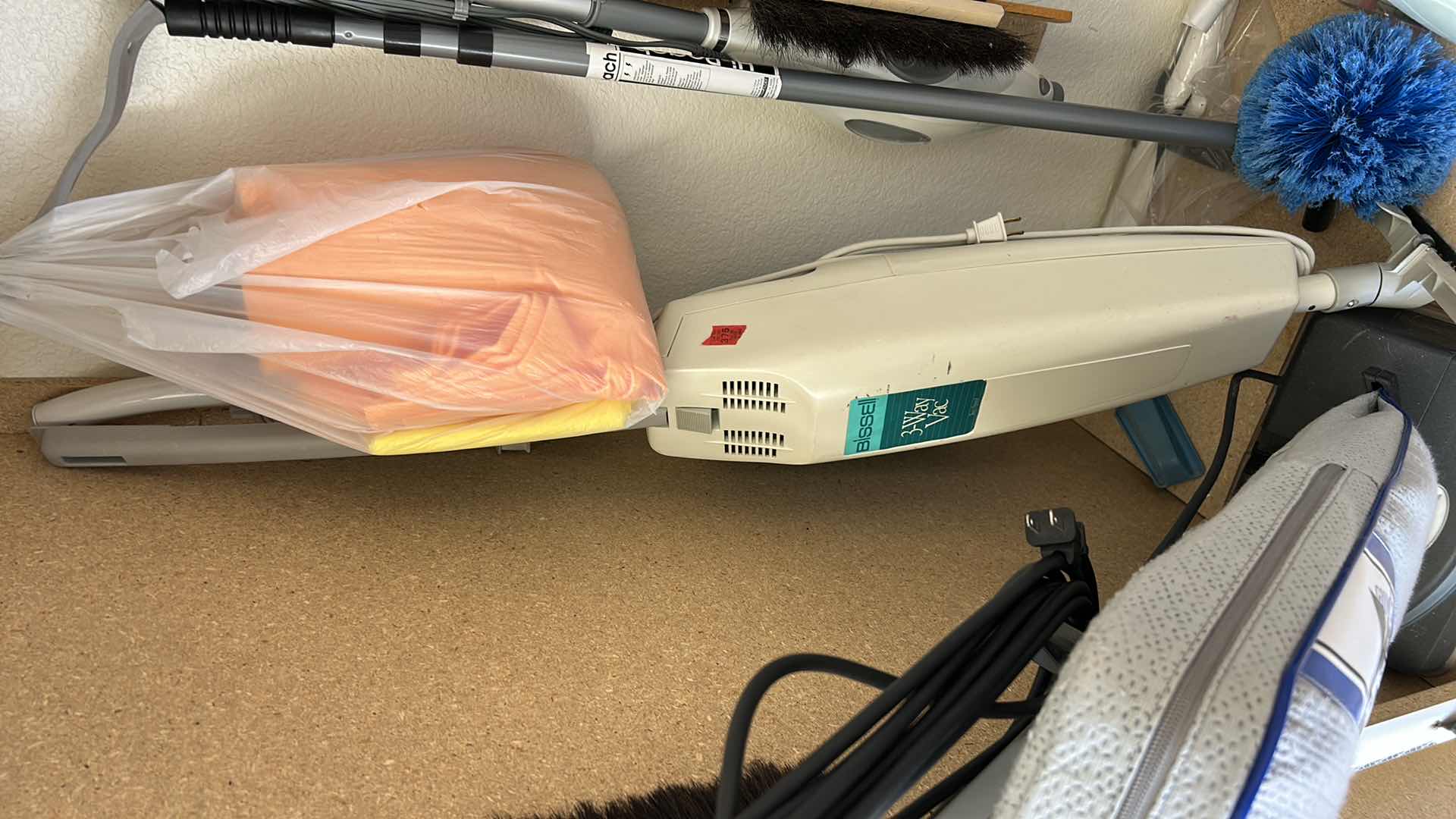 Photo 1 of CONTENTS IN CABINET, ORECK VACUUM, FLOOR CLEANER AND MORE