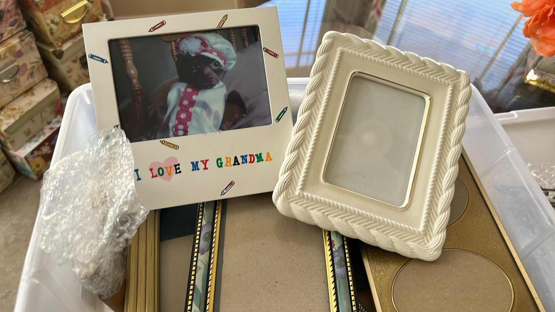 Photo 1 of CONTENTS OF PLASTIC CONTAINER ASSORTED PICTURE FRAMES