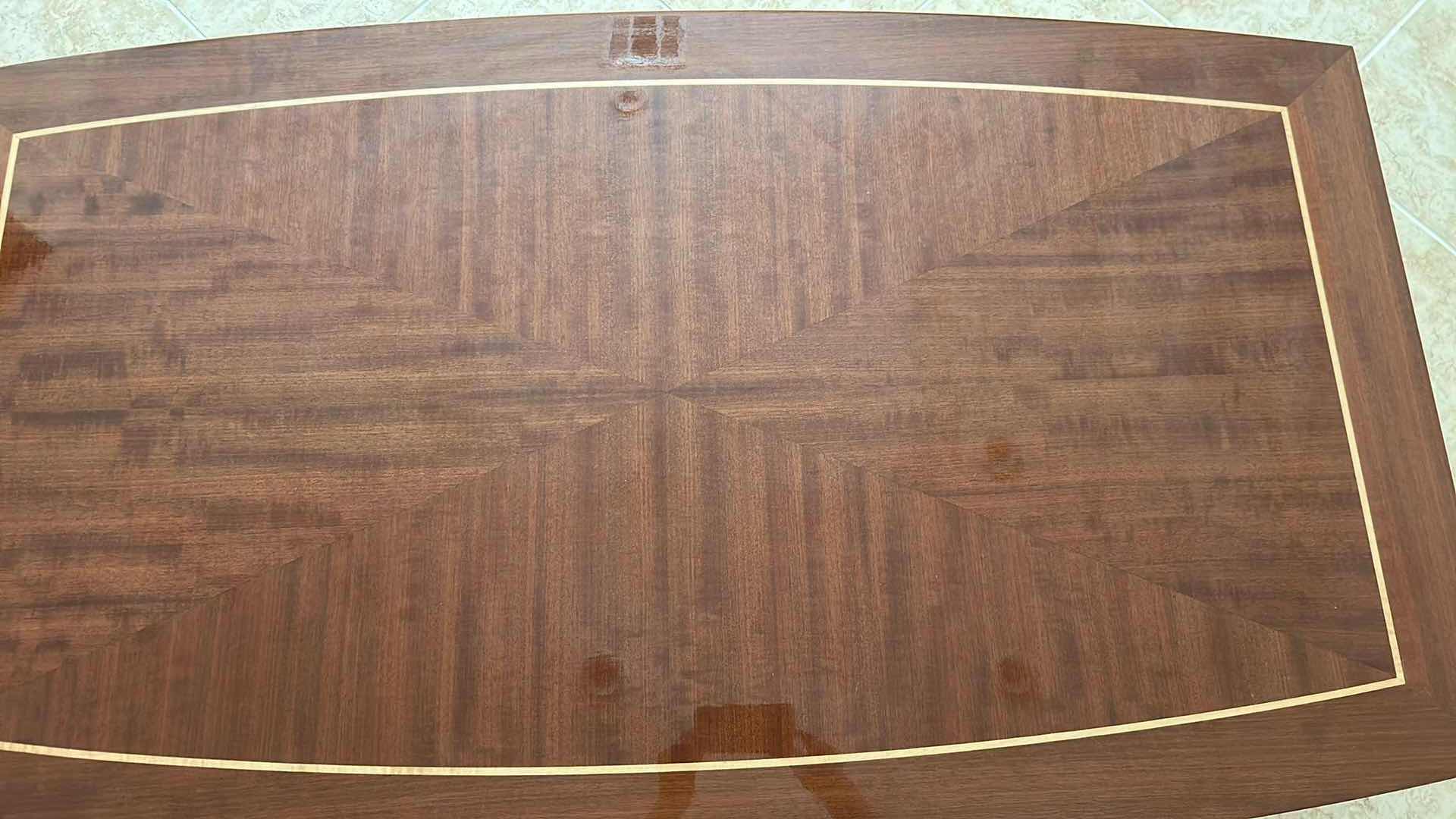 Photo 1 of STARBURST MAHOGANY VENEER W CONTRASTING INLAY BORDER COFFEE TABLE W CURVED ARCH BASE 54" X 31" H 17"