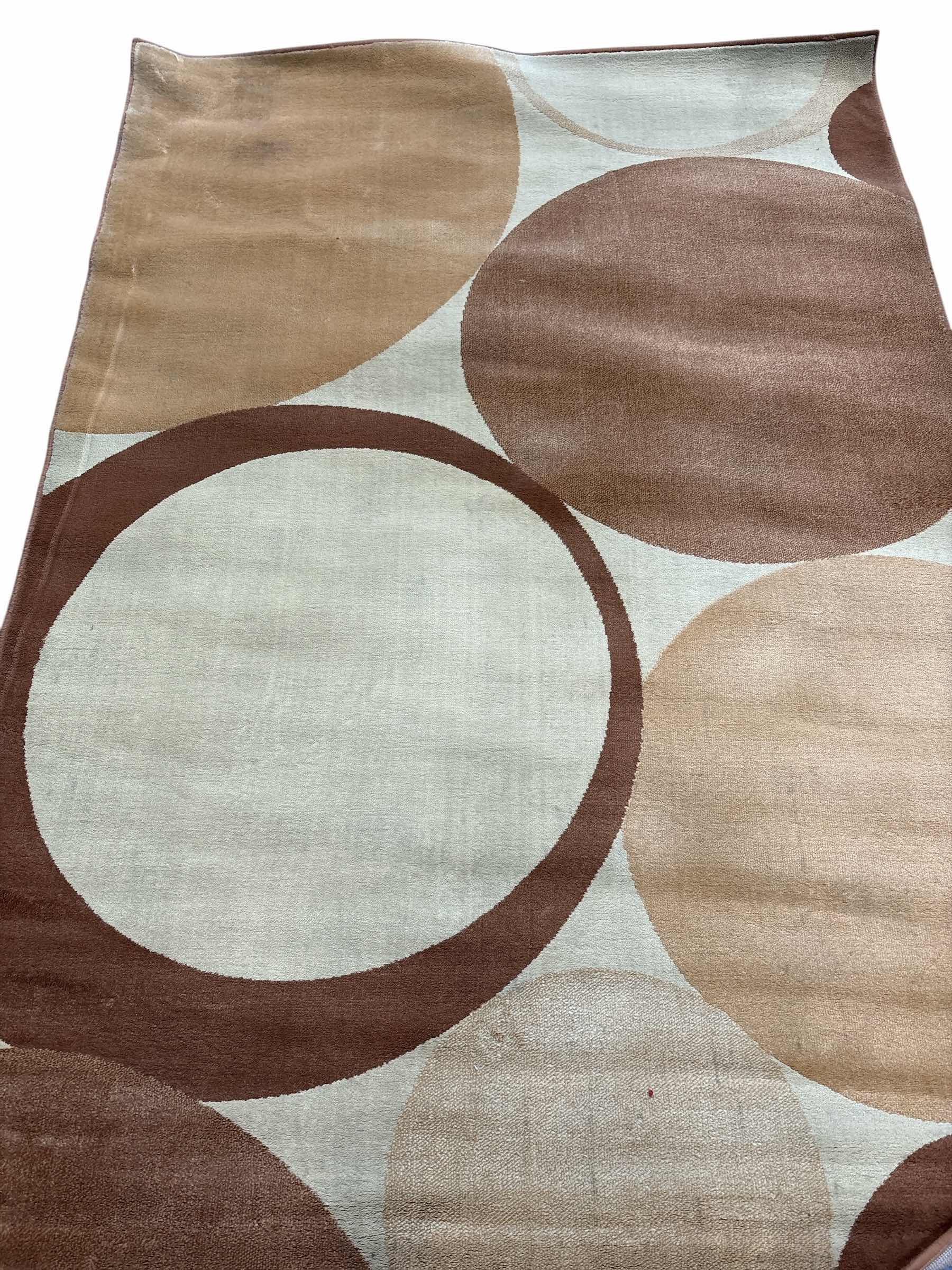 Photo 1 of GOLD CIRCLES RUG 89.5”X62”