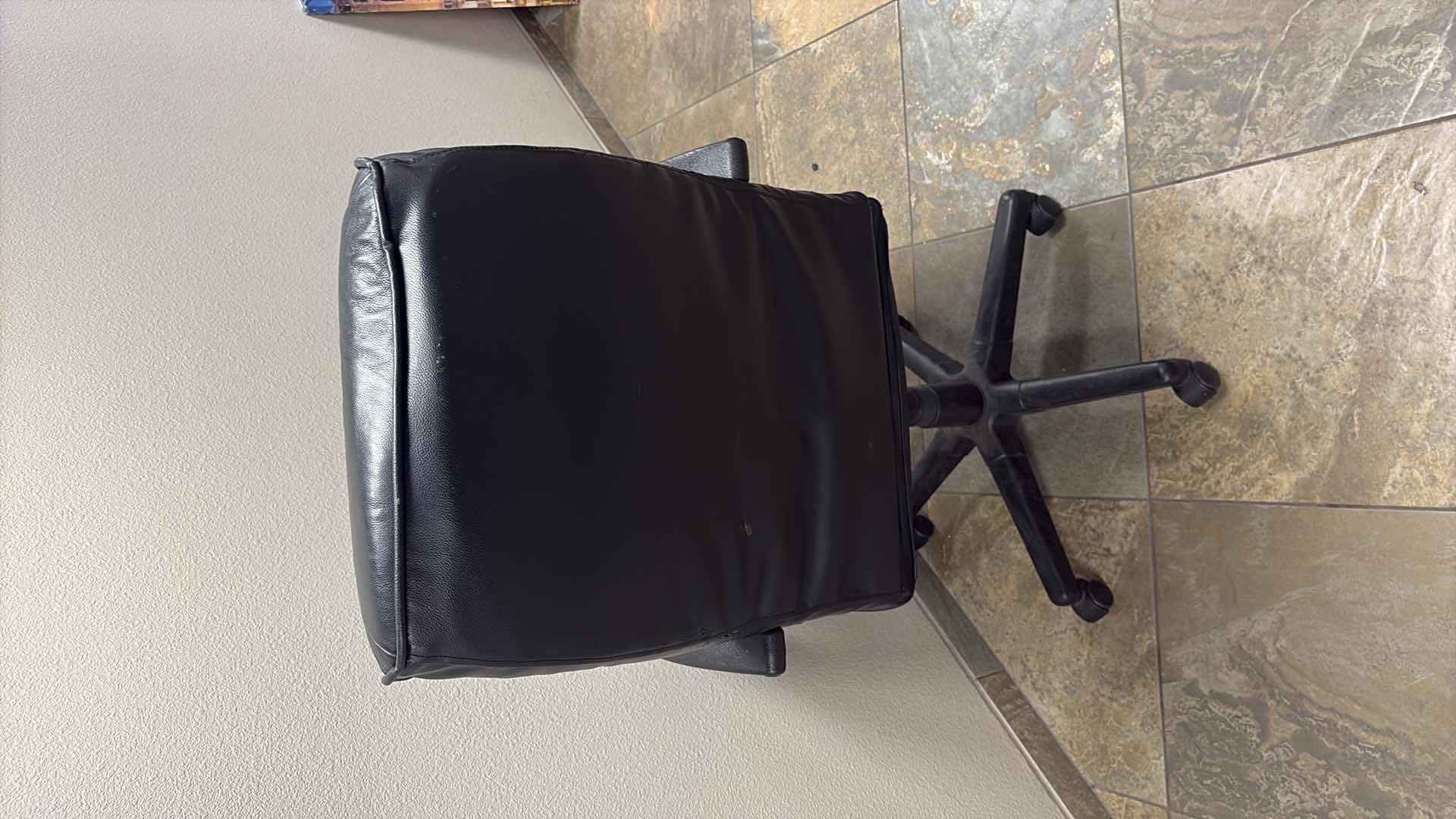 Photo 1 of BLACK LEATHER EXECUTIVE ROLLING OFFICE CHAIR 