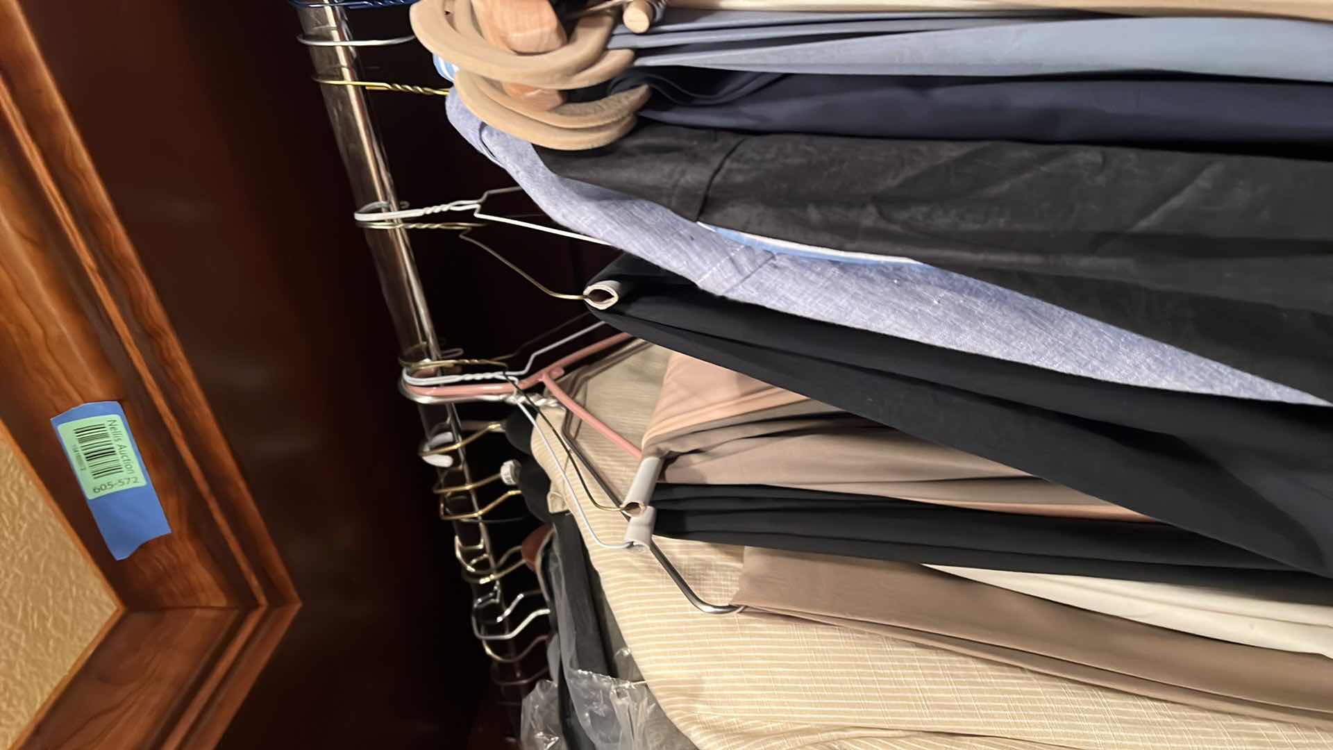 Photo 1 of CONTENTS OF RACK. MEN’S DESIGNER, JACKETS, PANTS, ETC.. SIZE LARGE TO EXTRA LARGE SOME NEW WITH TAGS.