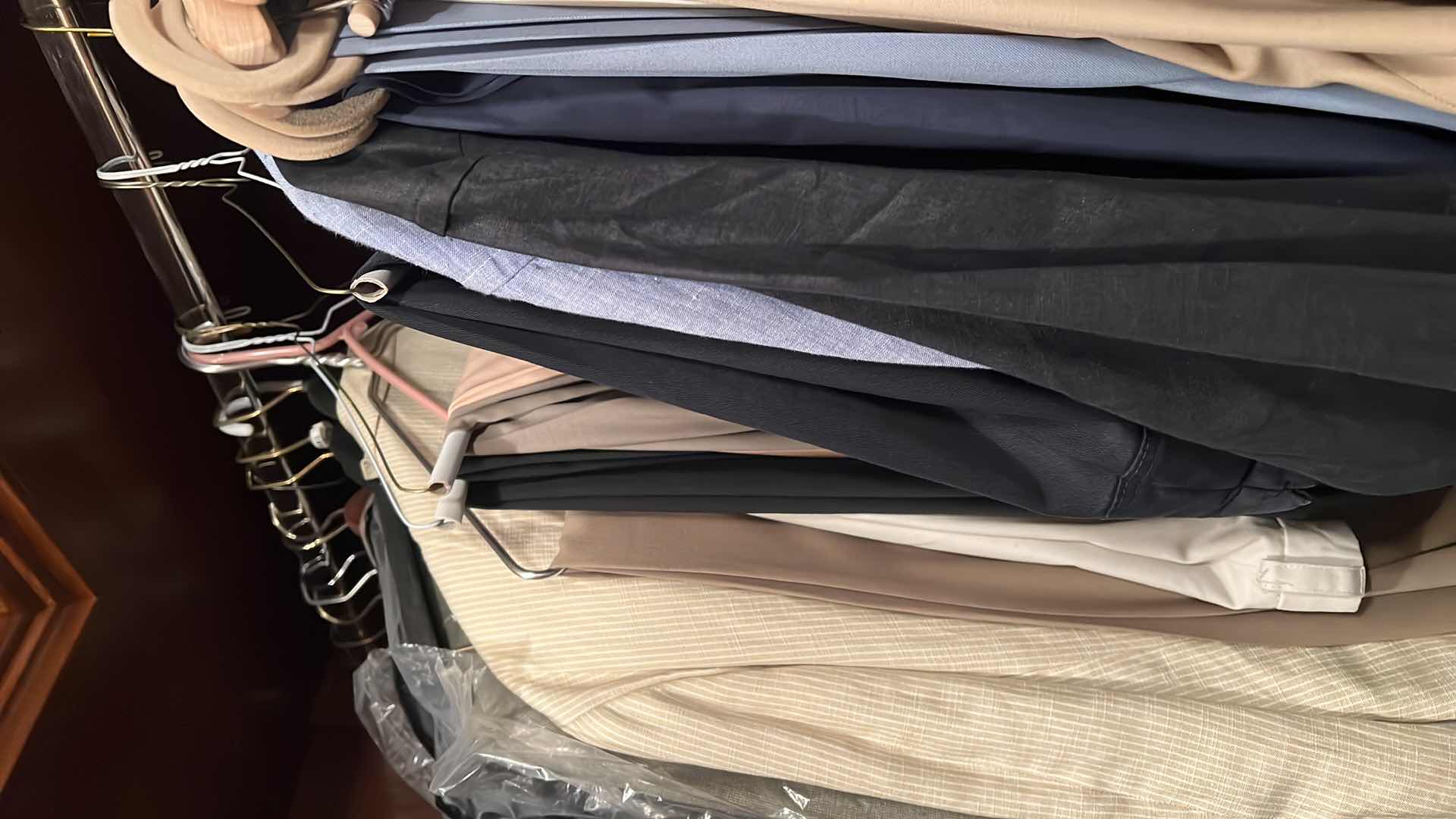 Photo 1 of CONTENTS OF RACK. MEN’S DESIGNER, JACKETS, PANTS, ETC.. SIZE LARGE TO EXTRA LARGE SOME NEW WITH TAGS.