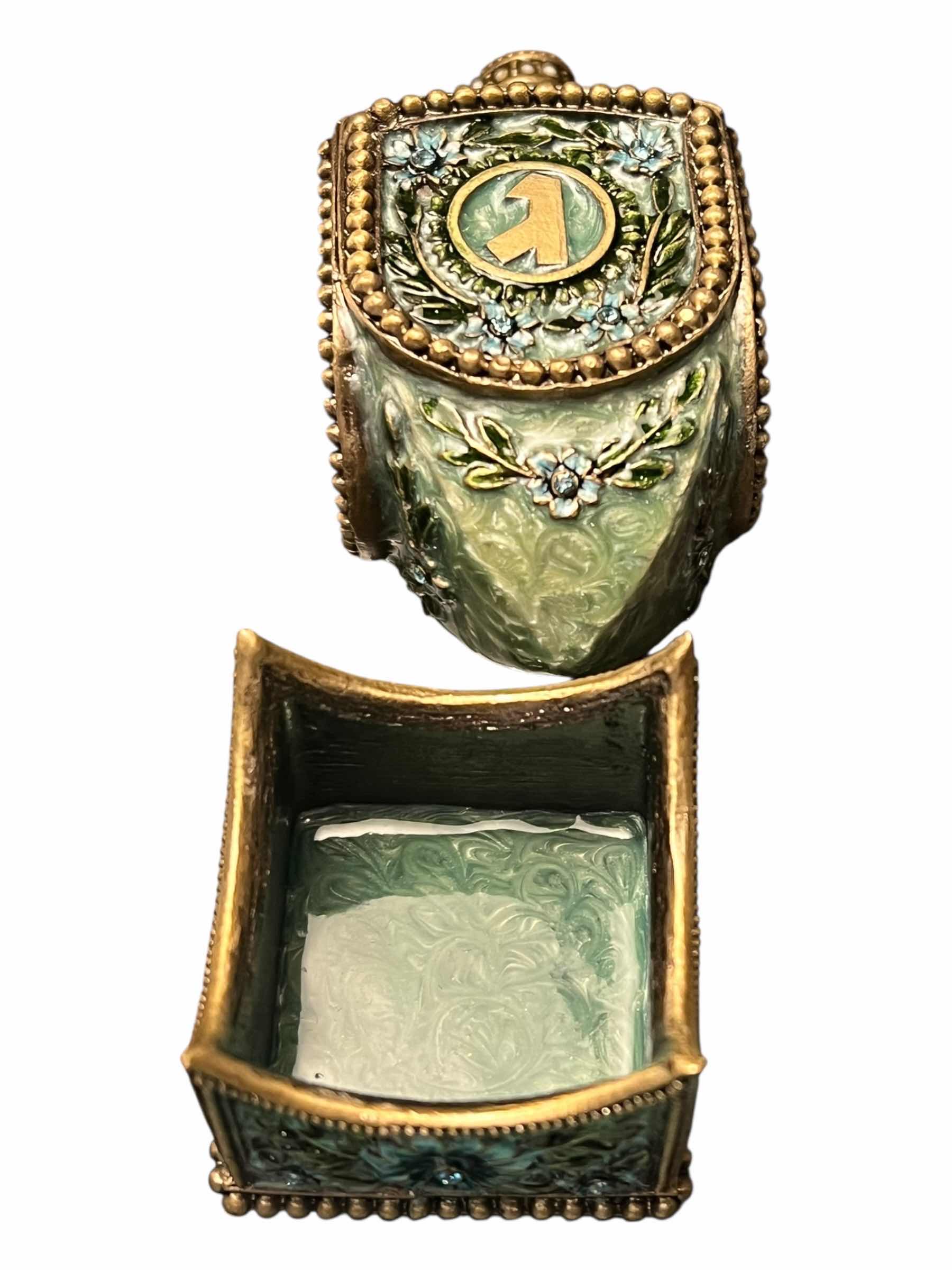 Photo 1 of JADE AND JEWEL EMBELLISHED DREIDEL 2“ X 2”H.