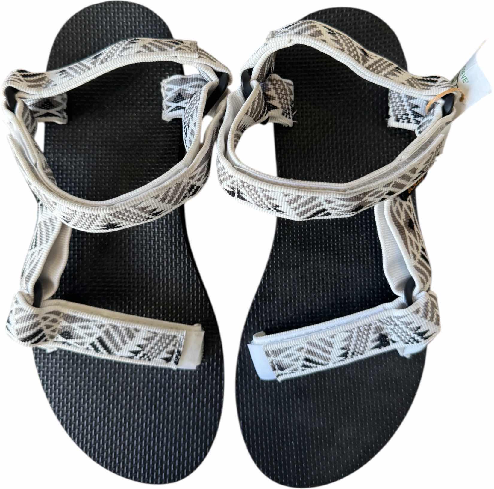 Photo 1 of NEW TEVA  BLACK & WHITE UNIVERSAL WOMENS SANDALS (SIZE 8 )

