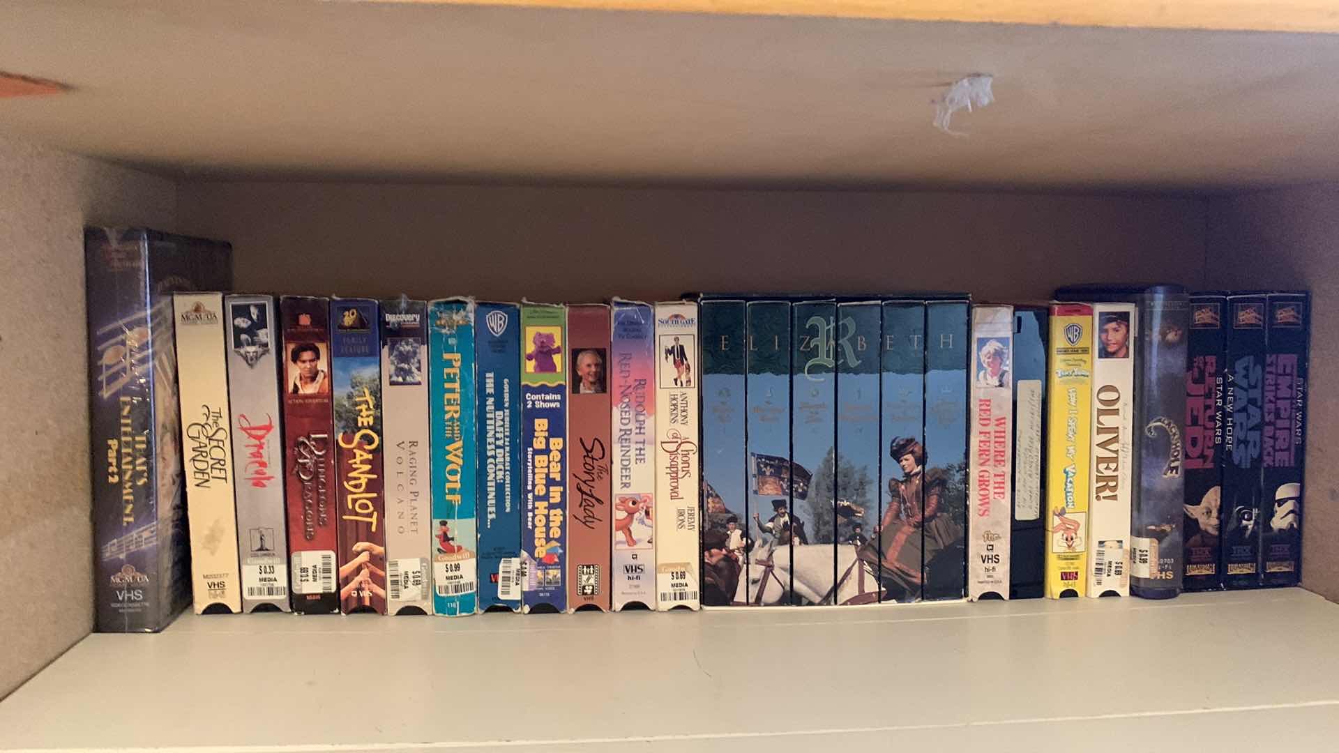 Photo 1 of SHELF OF VHS TAPES
