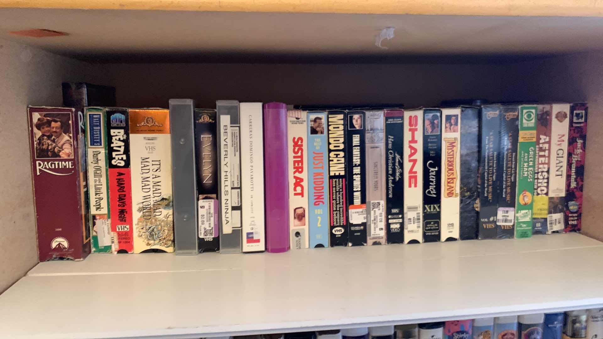 Photo 1 of SHELF OF VHS TAPES
