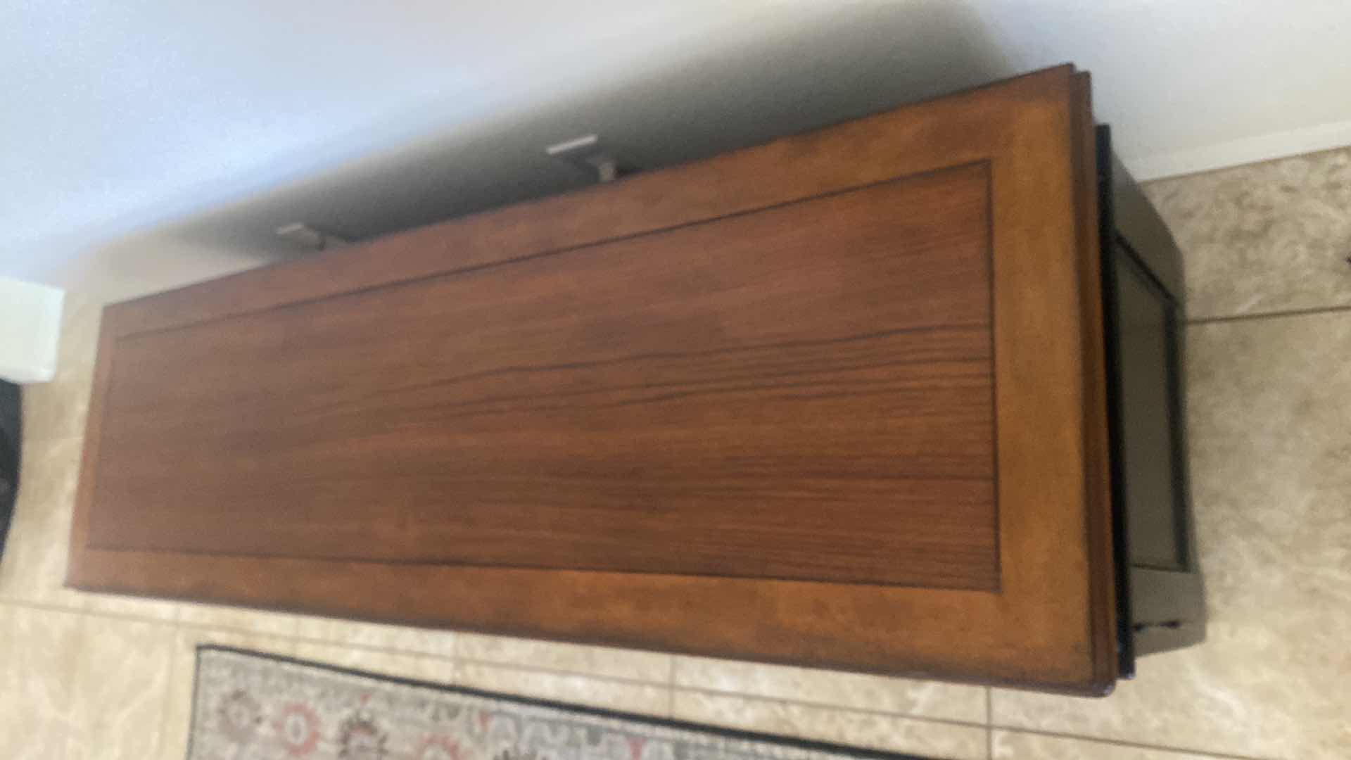 Photo 1 of DARK WOOD ENTERTAINMENT CENTER WITH THREE GLASS DOORS AND THREE DRAWERS 59“ X 18“ H 24