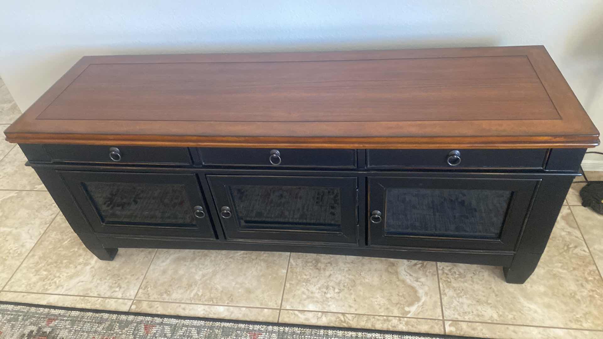 Photo 1 of DARK WOOD ENTERTAINMENT CENTER WITH THREE GLASS DOORS AND THREE DRAWERS 59“ X 18“ H 24