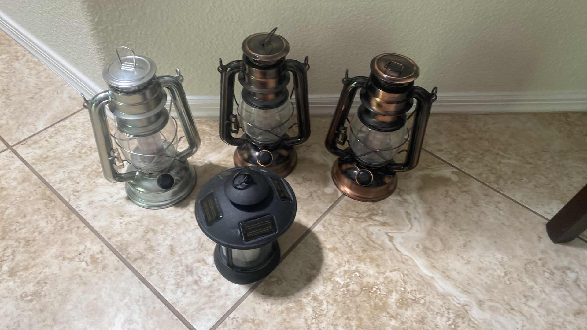 Photo 1 of 4-LANTERNS, ONE SOLAR POWERED THREE BATTERY OPERATED H9 1/2”