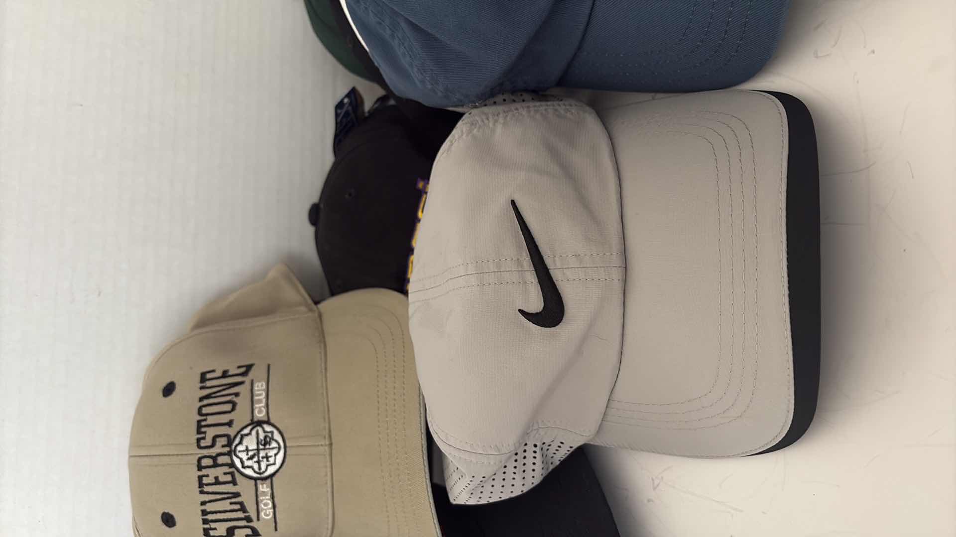 Photo 1 of MENS CAPS: NIKE, TAYLOR MADE, AND GOLF COURSES