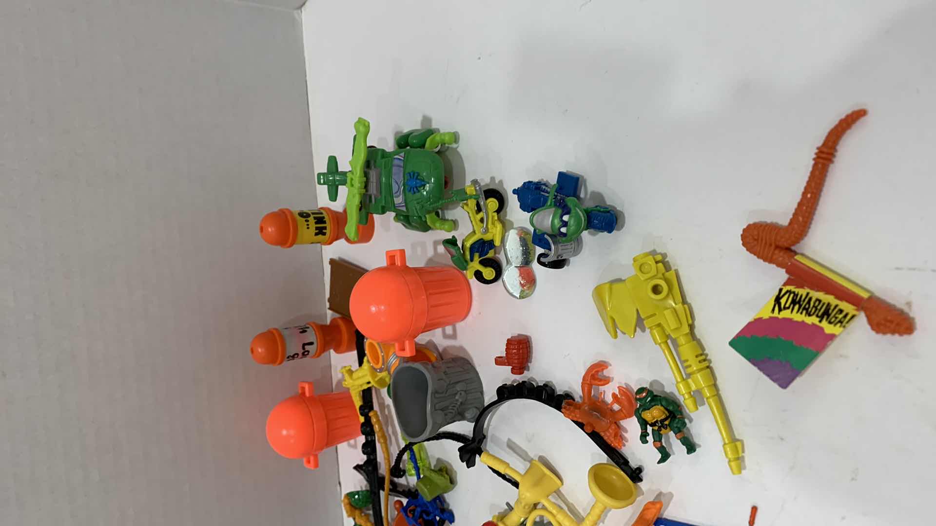 Photo 1 of VINTAGE TEENAGE MUTANT NINJA TURTLES ASSORTED WEAPONS AND GEAR