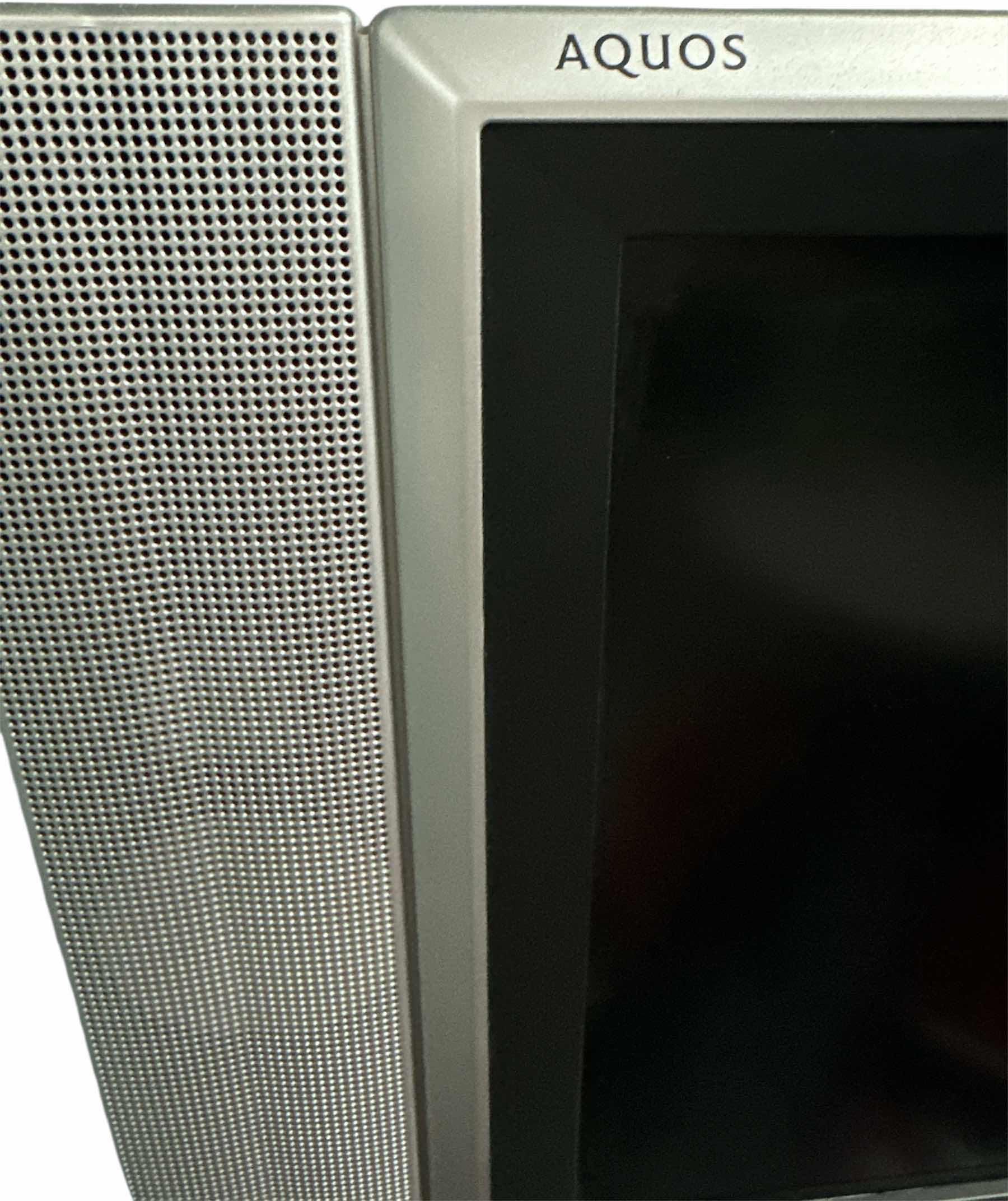 Photo 1 of 25” SHARP AQUOS TV WITH ATTACHED SIDE SPEAKERS
33.5” X 11” X 19.25”H