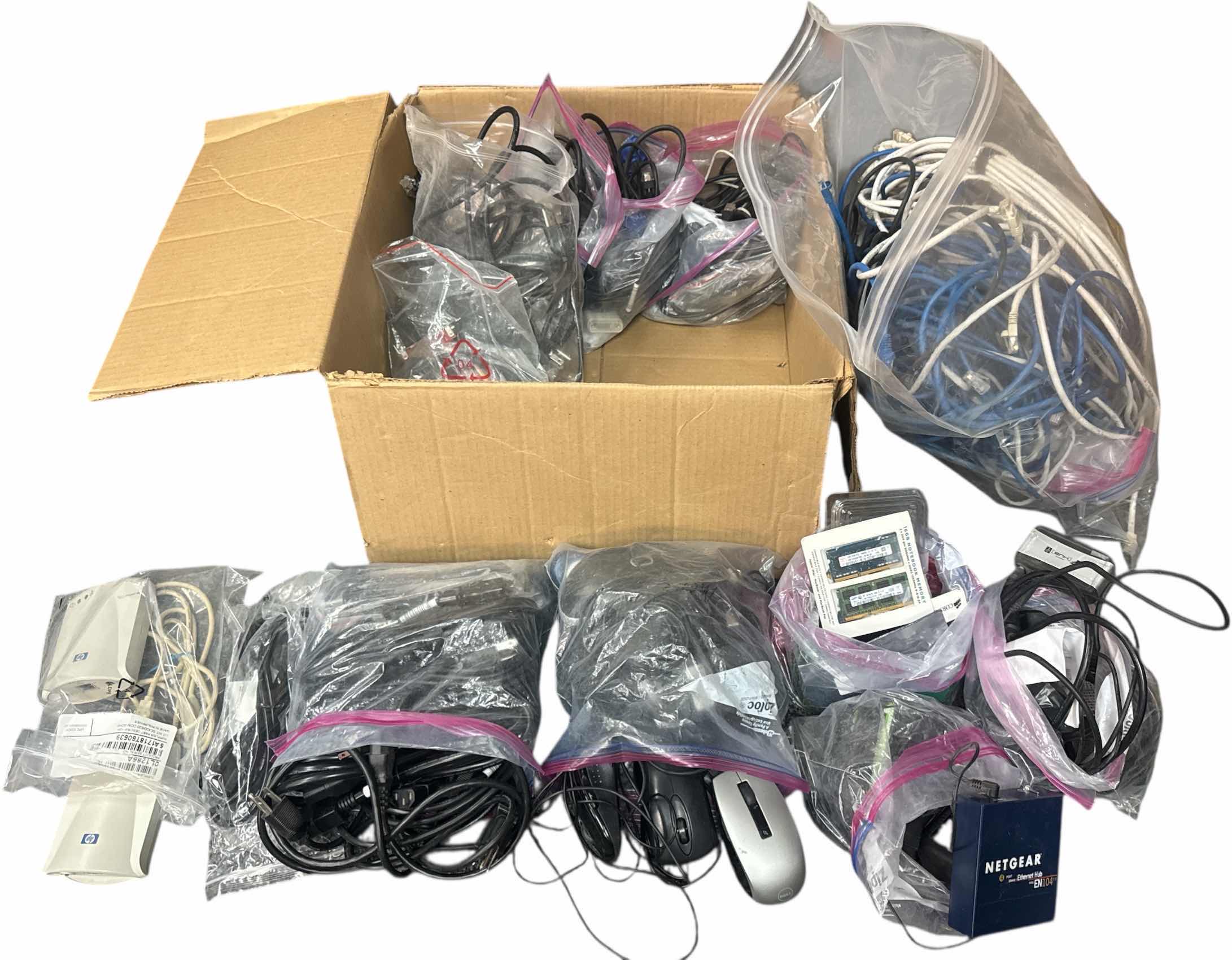 Photo 1 of BOX OF ASSORTED COMPUTER CABLES, POWER CORDS, WIRED MOUSE, HDMI, PRINT SERVERS HP JET 175X, MEMORY CHIPS
BOX
19” X 18” X H9”