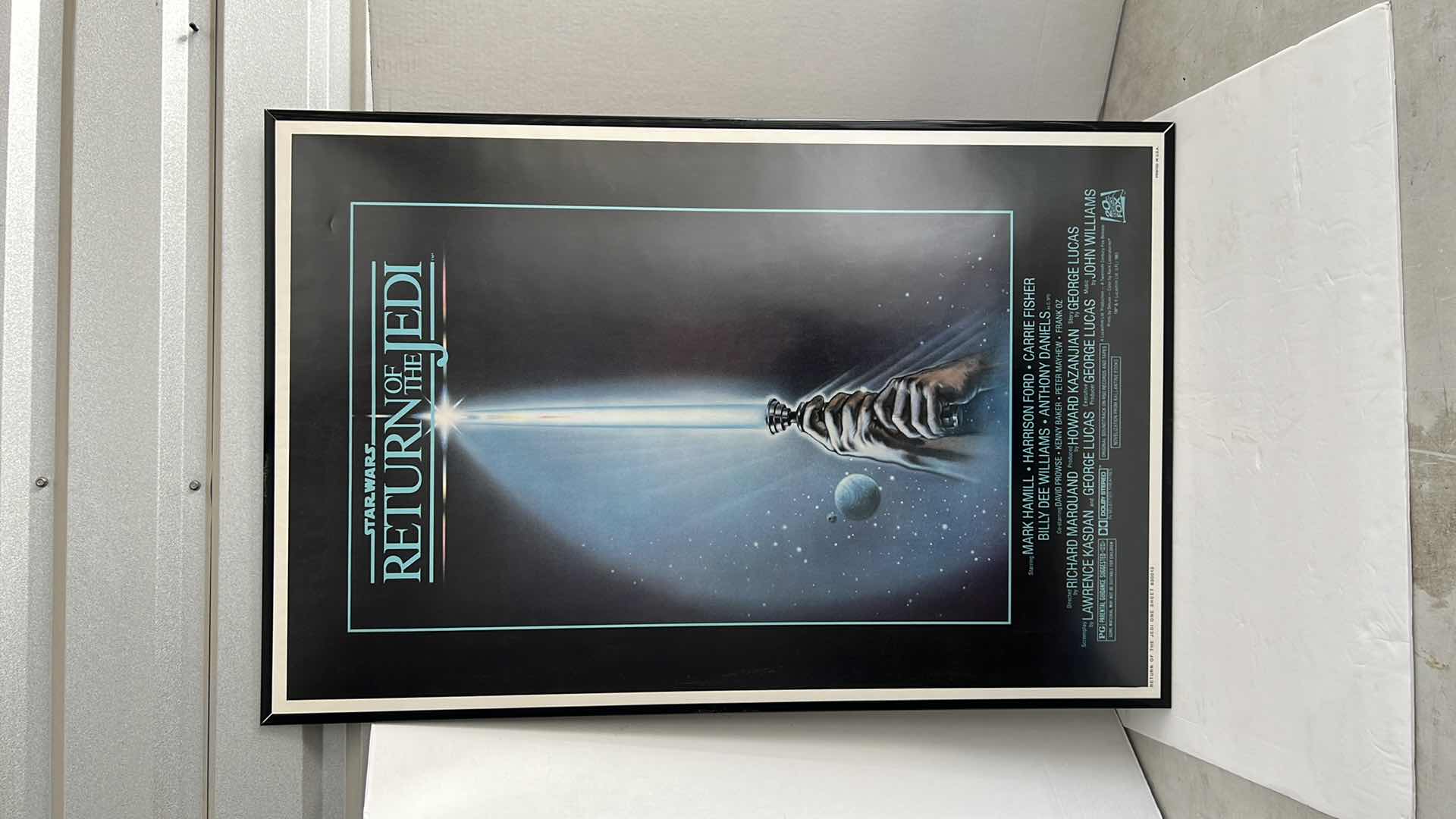 Photo 1 of STAR WARS RETURN OF THE JEDI MOVIE POSTER IN BLACK PLASTIC FRAME 27”W X 40”H