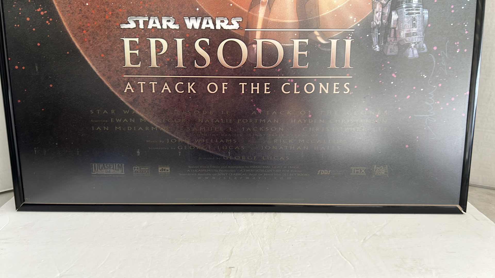Photo 1 of STAR WARS EPISODE II ATTACK OF THE CLONES MOVIE POSTER WITH BLACK PLASTIC FRAME 27”W X 40”H