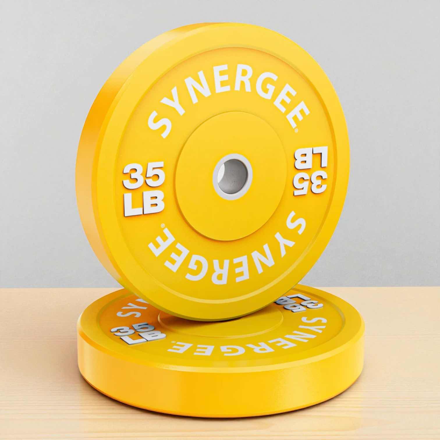 View 1 of NEW 35 LB YELLOW BUMPER WEIGHTED PLATE 17.5” DIAMETER AND 2” IN COLLAR OPENING