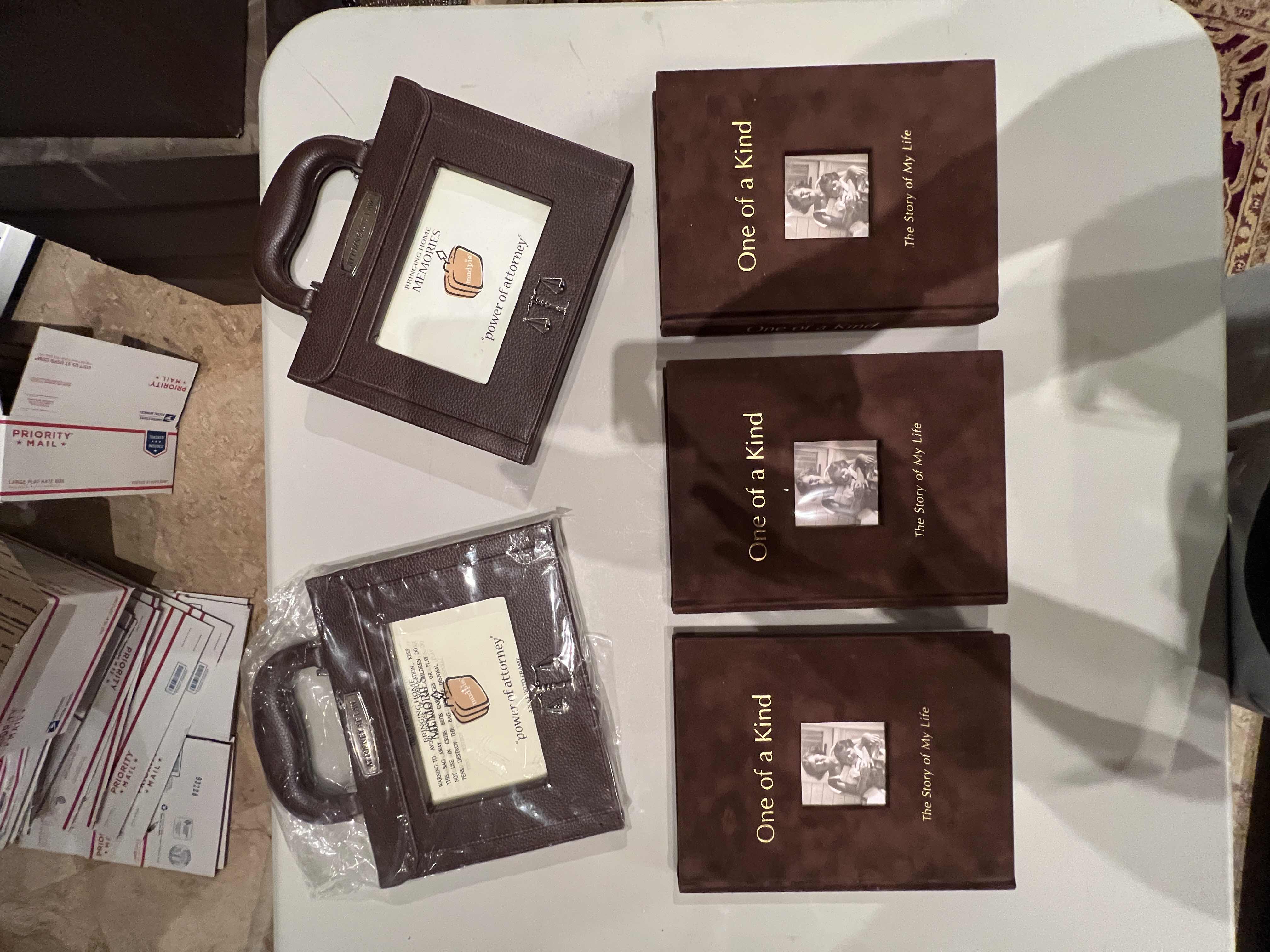 Photo 1 of ASSORTMENT OF 3 BLANK MEMORY BOOKS AND 2 PHOTO FRAMES