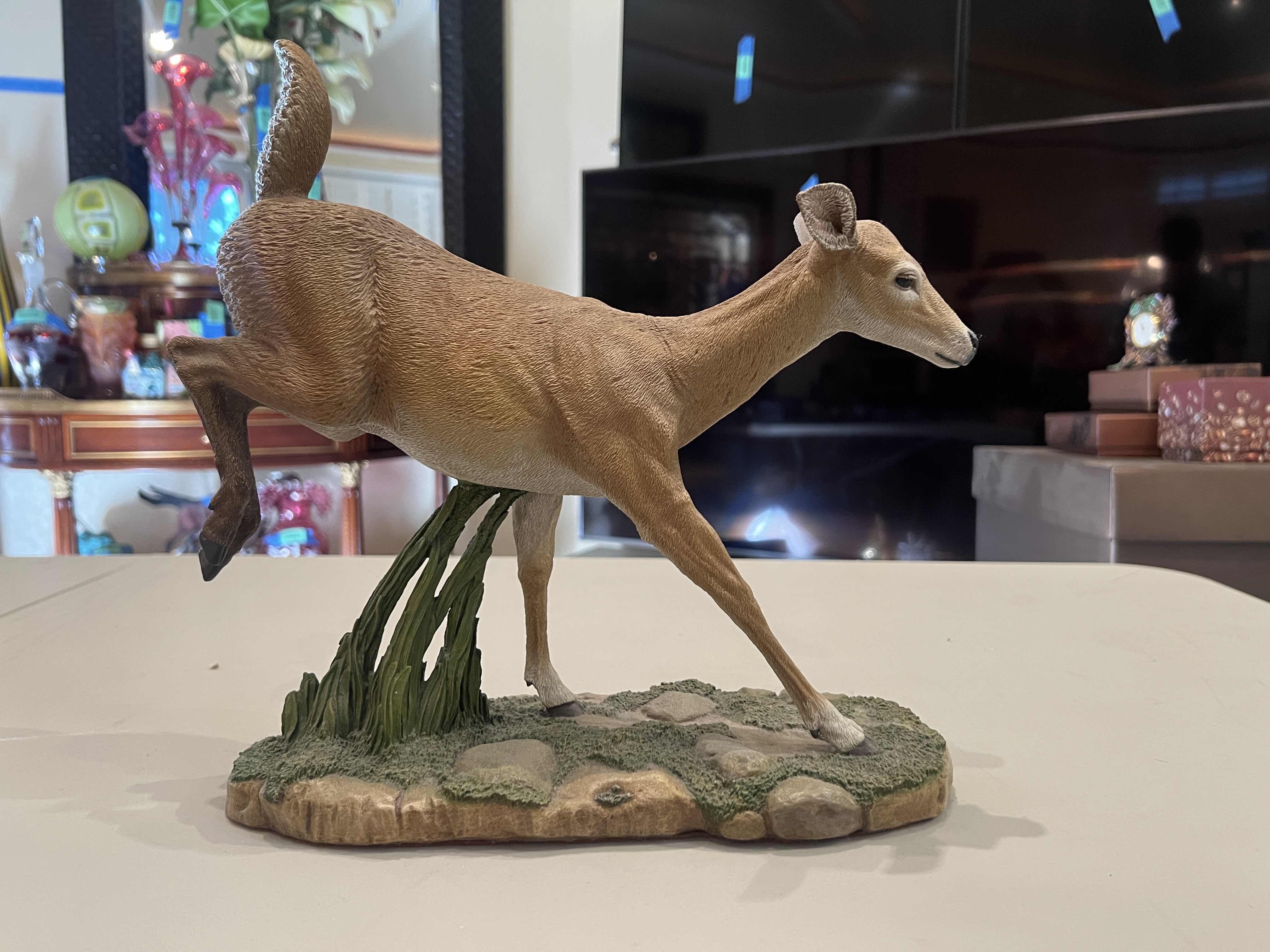 Photo 1 of CREART RESIN DEER ON GRASS AND ROCKS 125/2500 11”H X 13”W