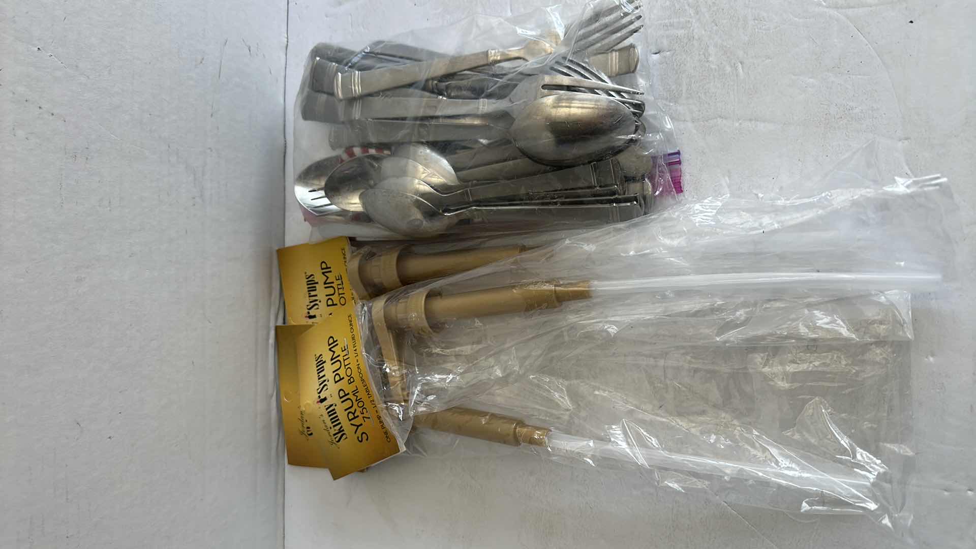 Photo 1 of SILVERWARE SET, 3-NEW SYRUP PUMPS