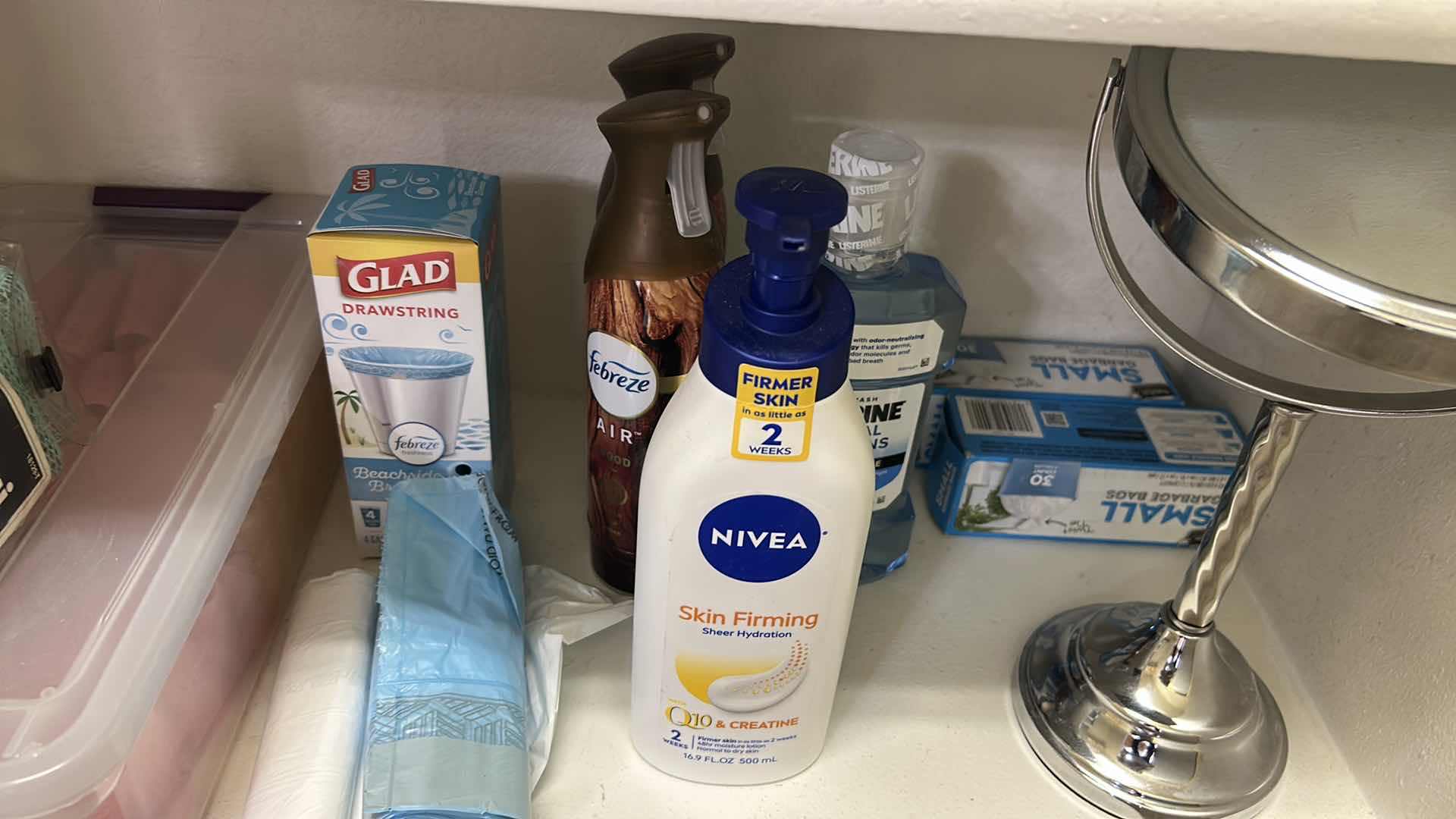 Photo 1 of CONTENTS OF SHELF MIRROR TRASH BAGS FEBREZE