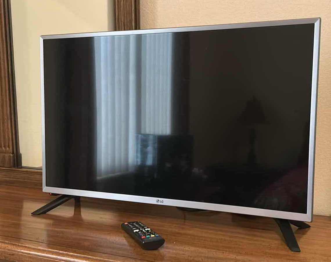 Photo 1 of LG 32” TV W REMOTE AND STAND