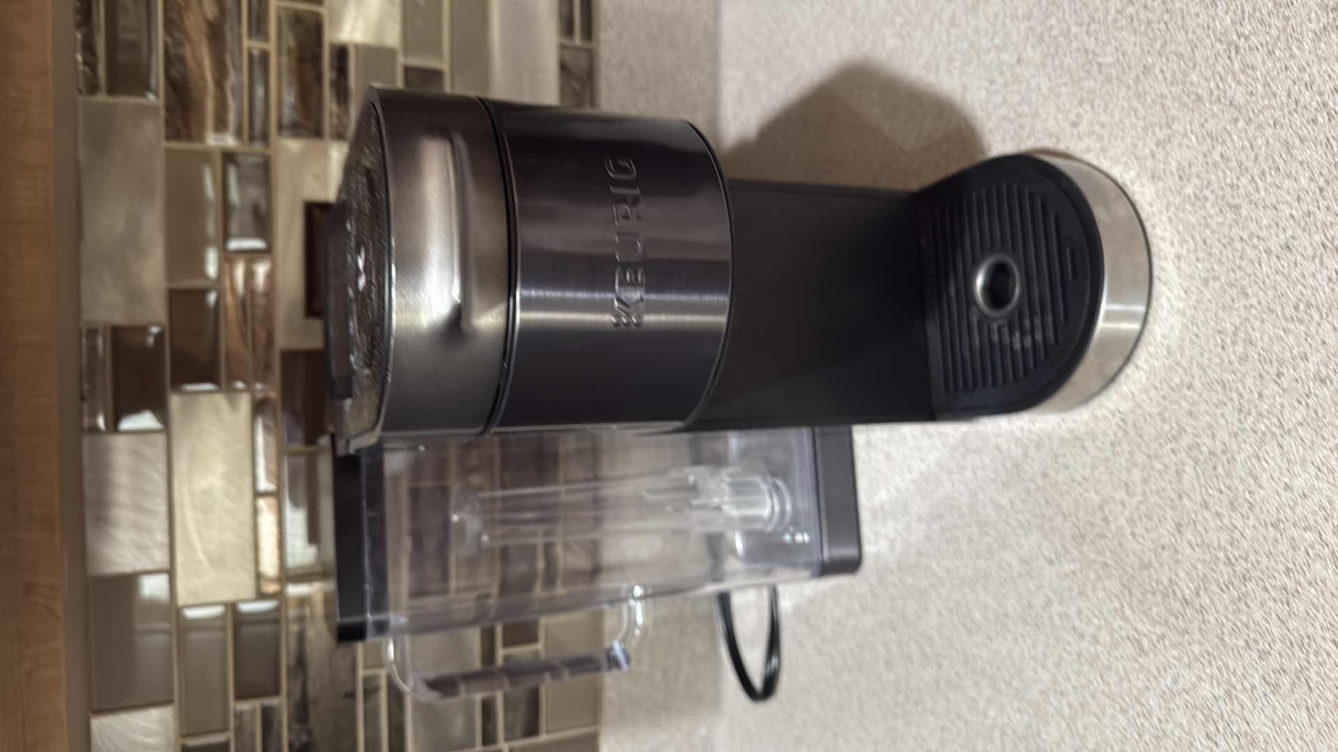 Photo 1 of BLACK KEURIG COFFEE MAKER & 3 POD HOLDERS