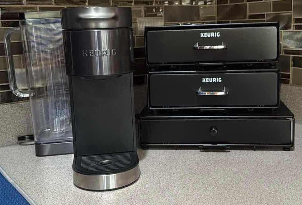 Photo 1 of BLACK KEURIG COFFEE MAKER & 3 POD HOLDERS