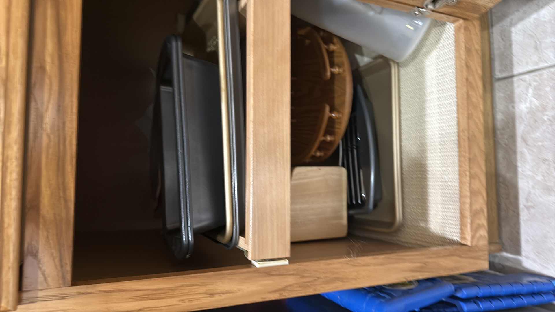 Photo 1 of CONTENTS OF KITCHEN CABINET-BAKEWARE, WOOD HOLDERS