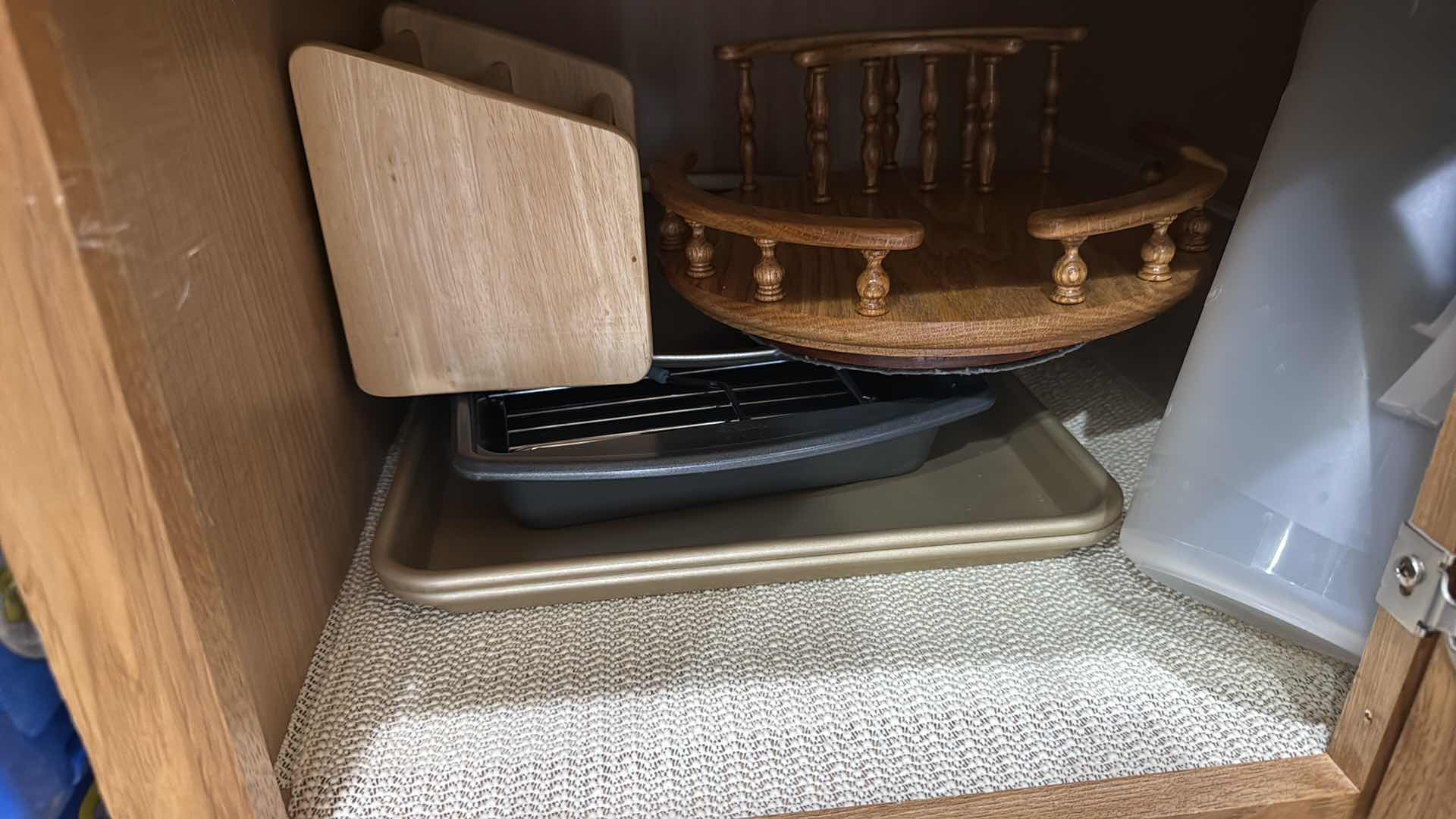 Photo 1 of CONTENTS OF KITCHEN CABINET-BAKEWARE, WOOD HOLDERS