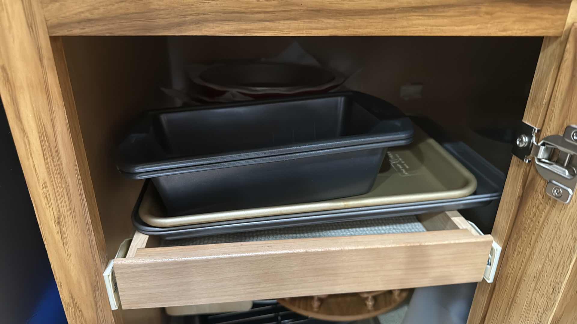 Photo 1 of CONTENTS OF KITCHEN CABINET-BAKEWARE, WOOD HOLDERS