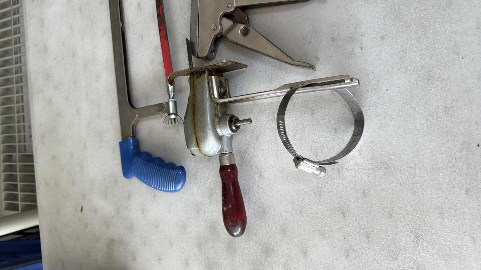 Photo 1 of SAWS, HEAVY STAPLER, BLACK & DECKER SCREWDRIVER, PUNCHER