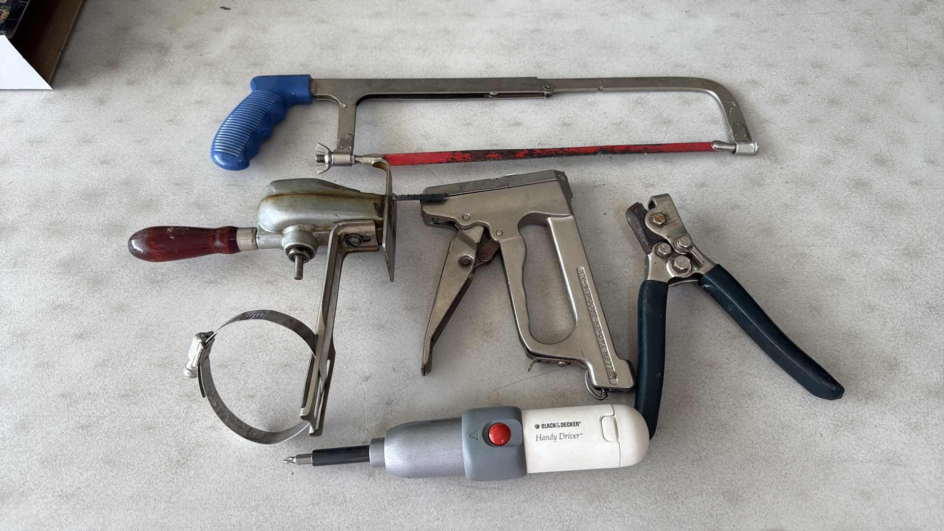 Photo 1 of SAWS, HEAVY STAPLER, BLACK & DECKER SCREWDRIVER, PUNCHER