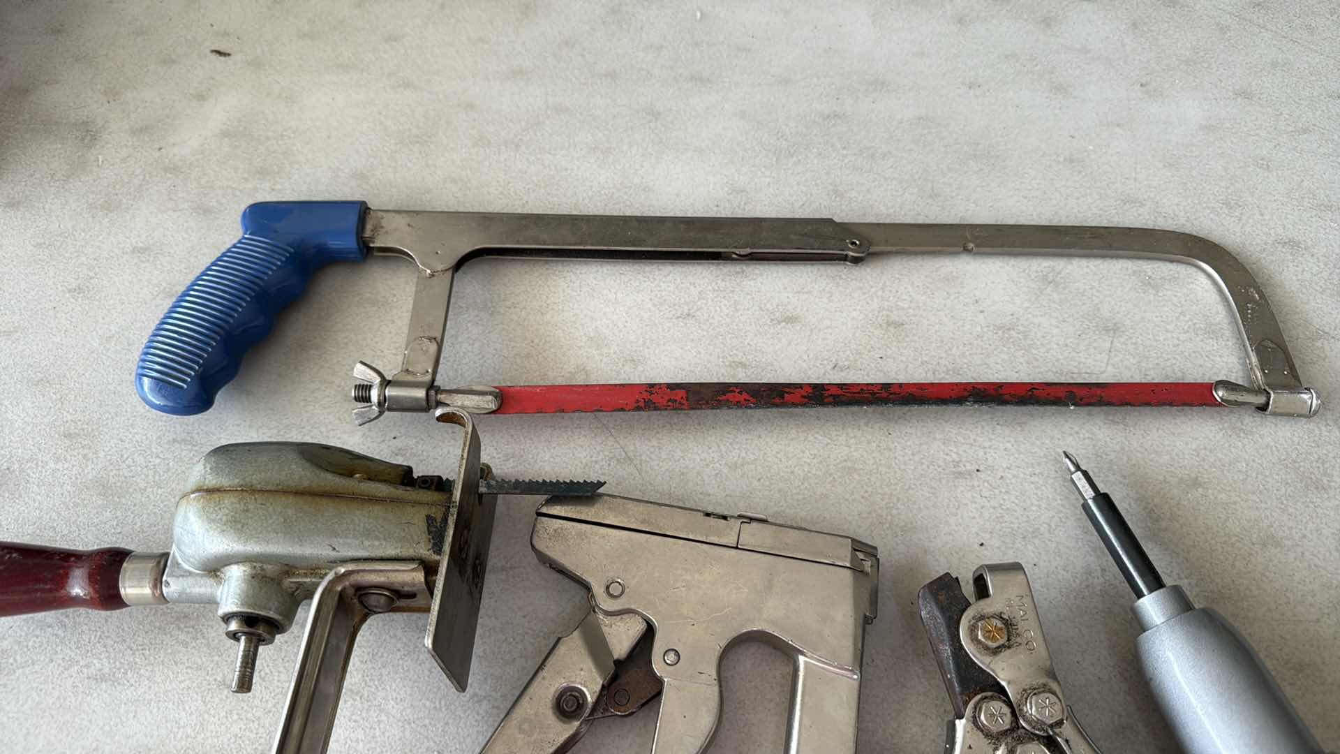 Photo 1 of SAWS, HEAVY STAPLER, BLACK & DECKER SCREWDRIVER, PUNCHER