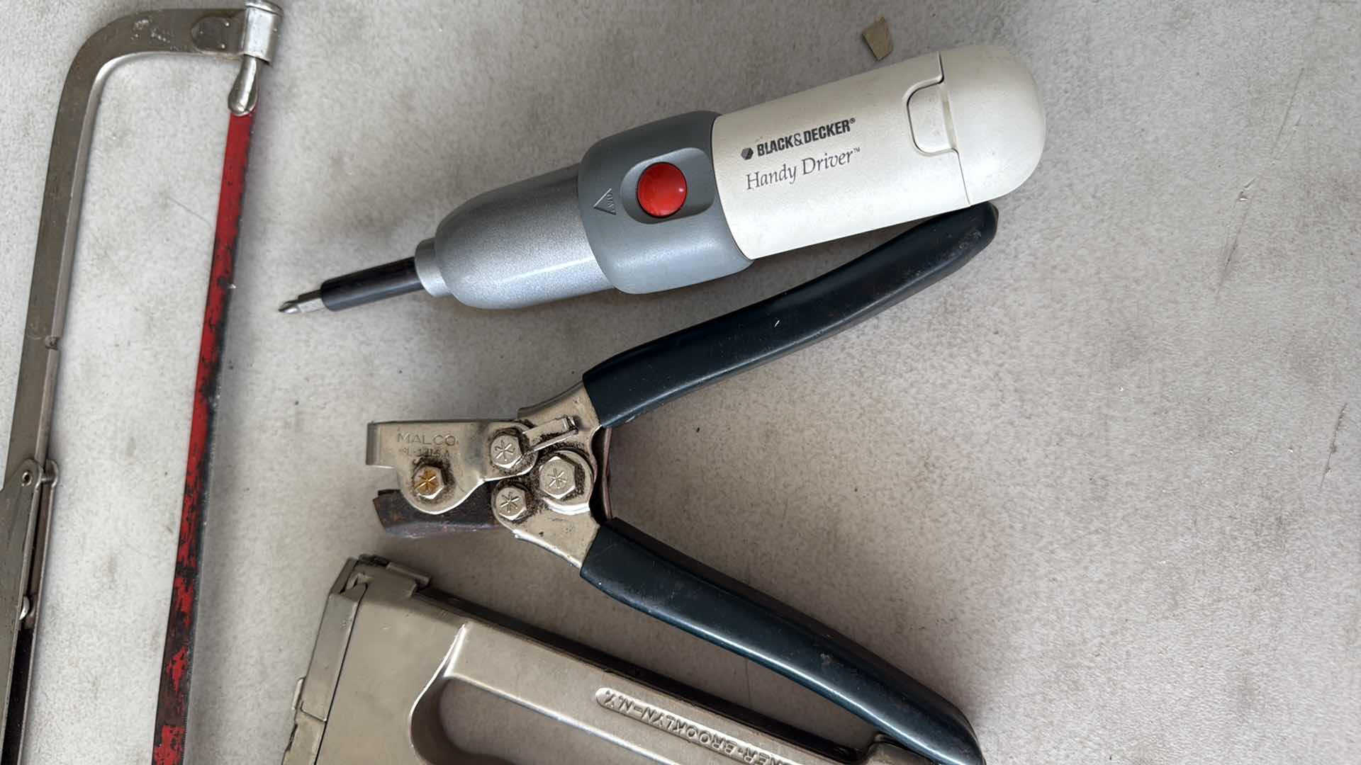 Photo 1 of SAWS, HEAVY STAPLER, BLACK & DECKER SCREWDRIVER, PUNCHER
