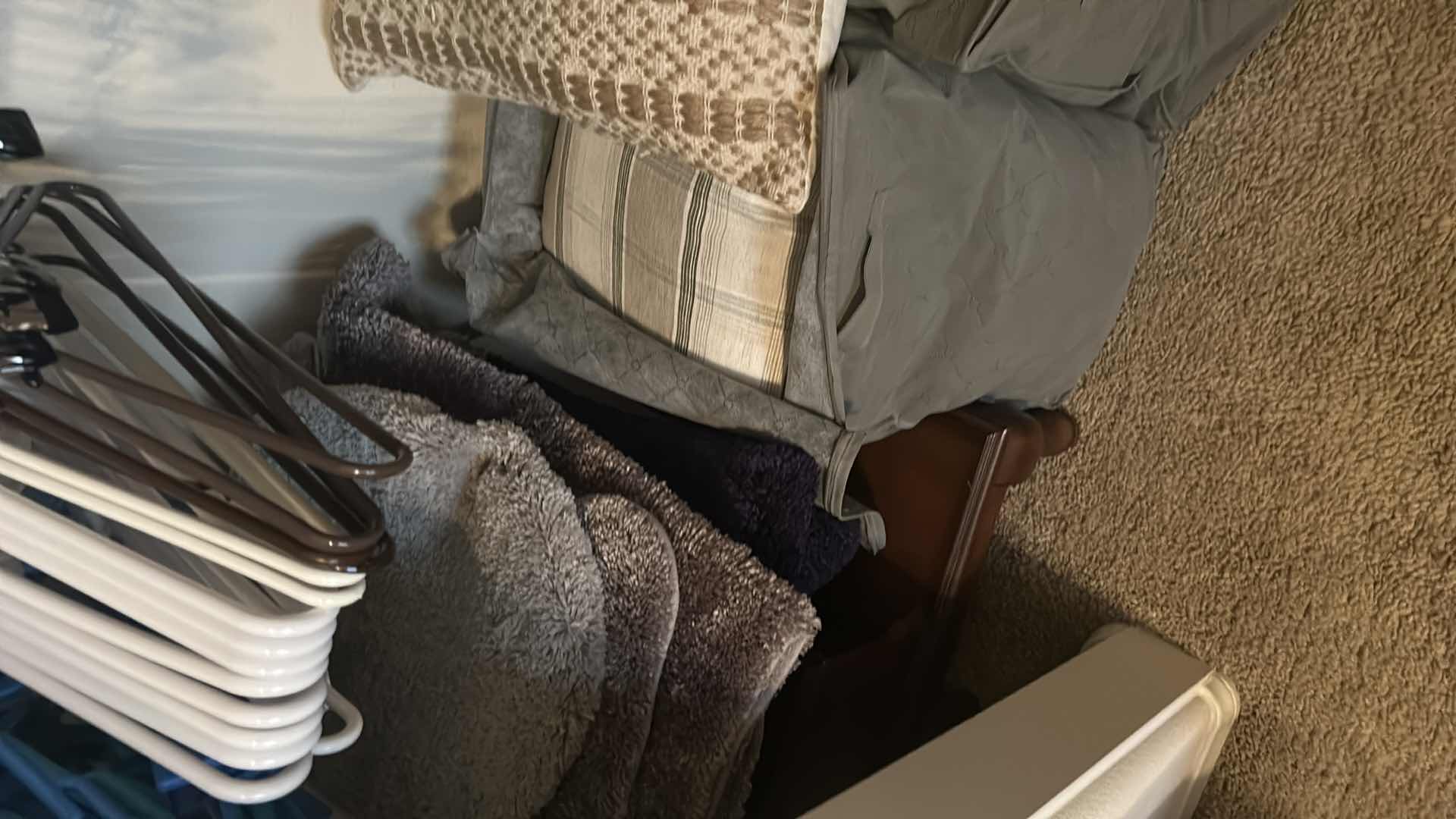 Photo 1 of CONTENTS OF CLOSET HANGERS ASSORTED FRAMES PILLOWS 2 WASTE  BASKETS 