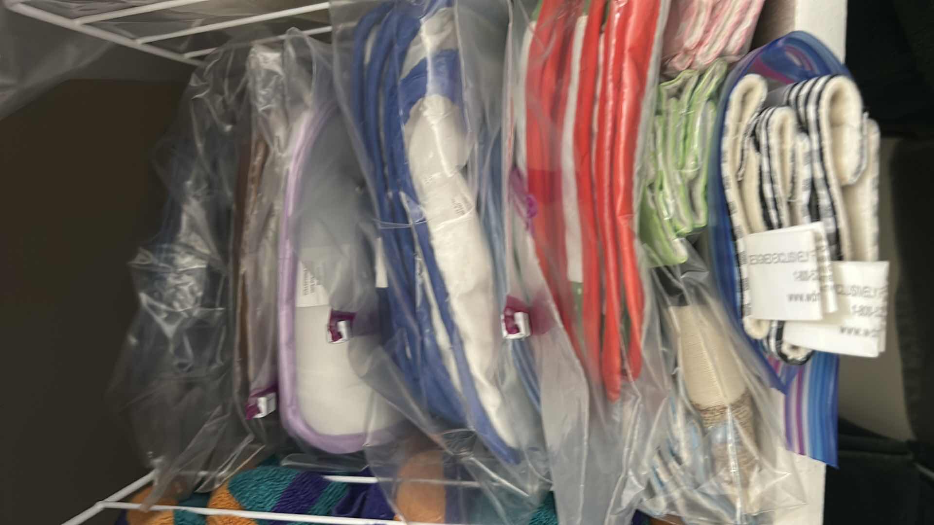 Photo 1 of CONTENTS OF SHELF BEACH TOWELS DECORATIVE KITCHEN OVEN MITTS DISH DRAINERS