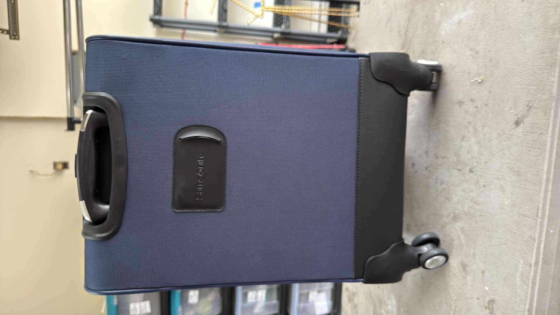 Photo 1 of SAMSONITE NAVY BLUE SOFTSIDE CARRY ON SPINNER LUGGAGE H23”