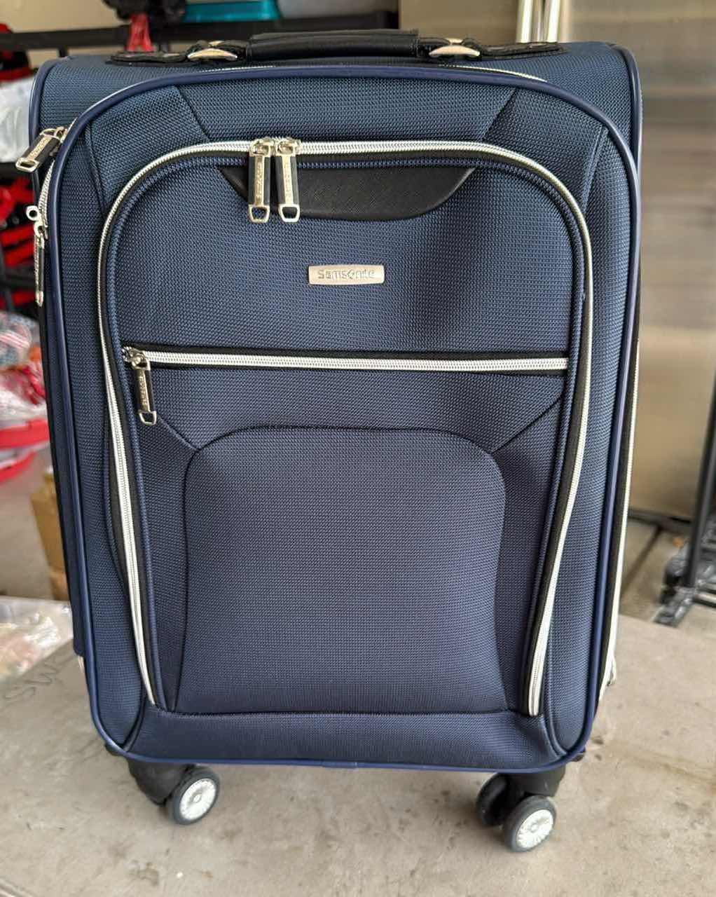 Photo 1 of SAMSONITE NAVY BLUE SOFTSIDE CARRY ON SPINNER LUGGAGE H23”