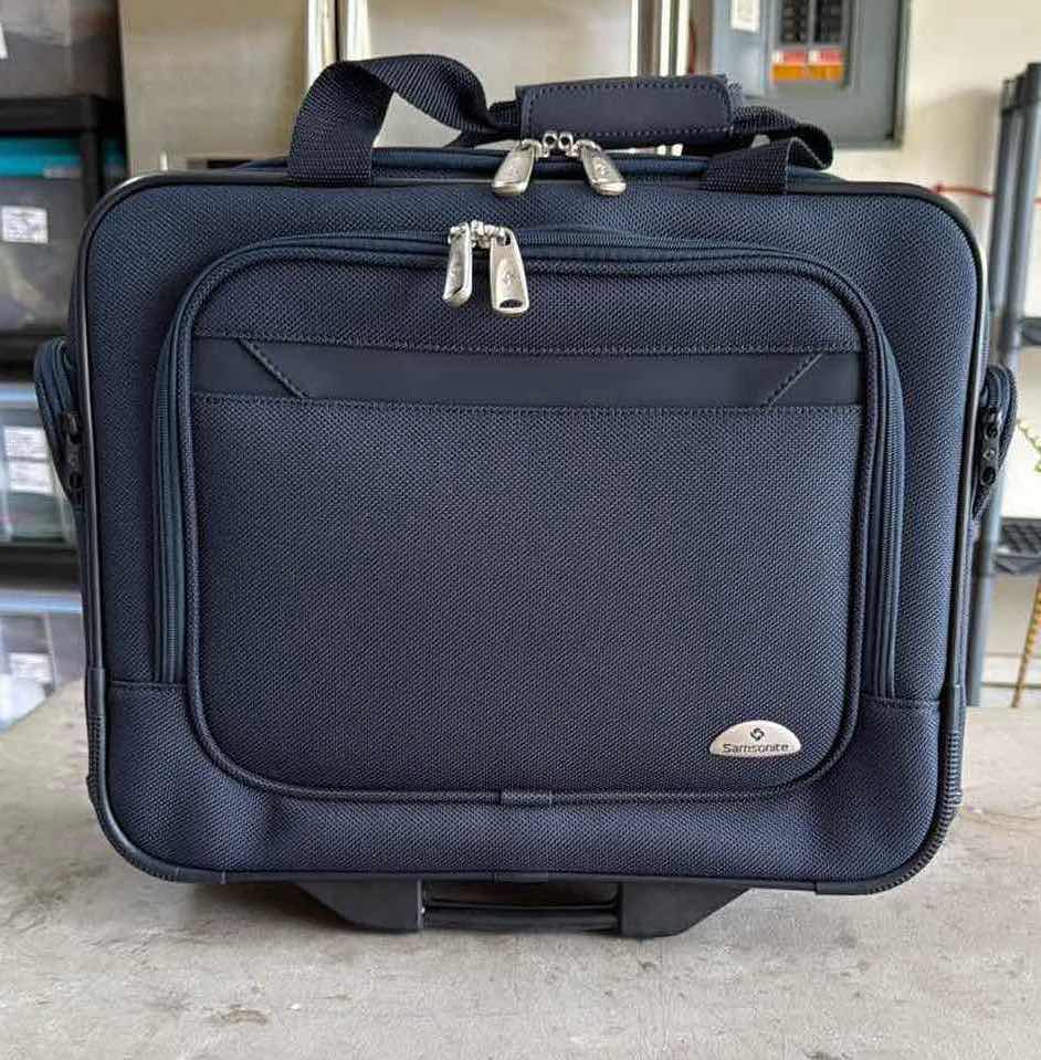 Photo 1 of SAMSONITE NAVY BLUE SOFTSIDE CARRY ON SPINNER W19” H16”