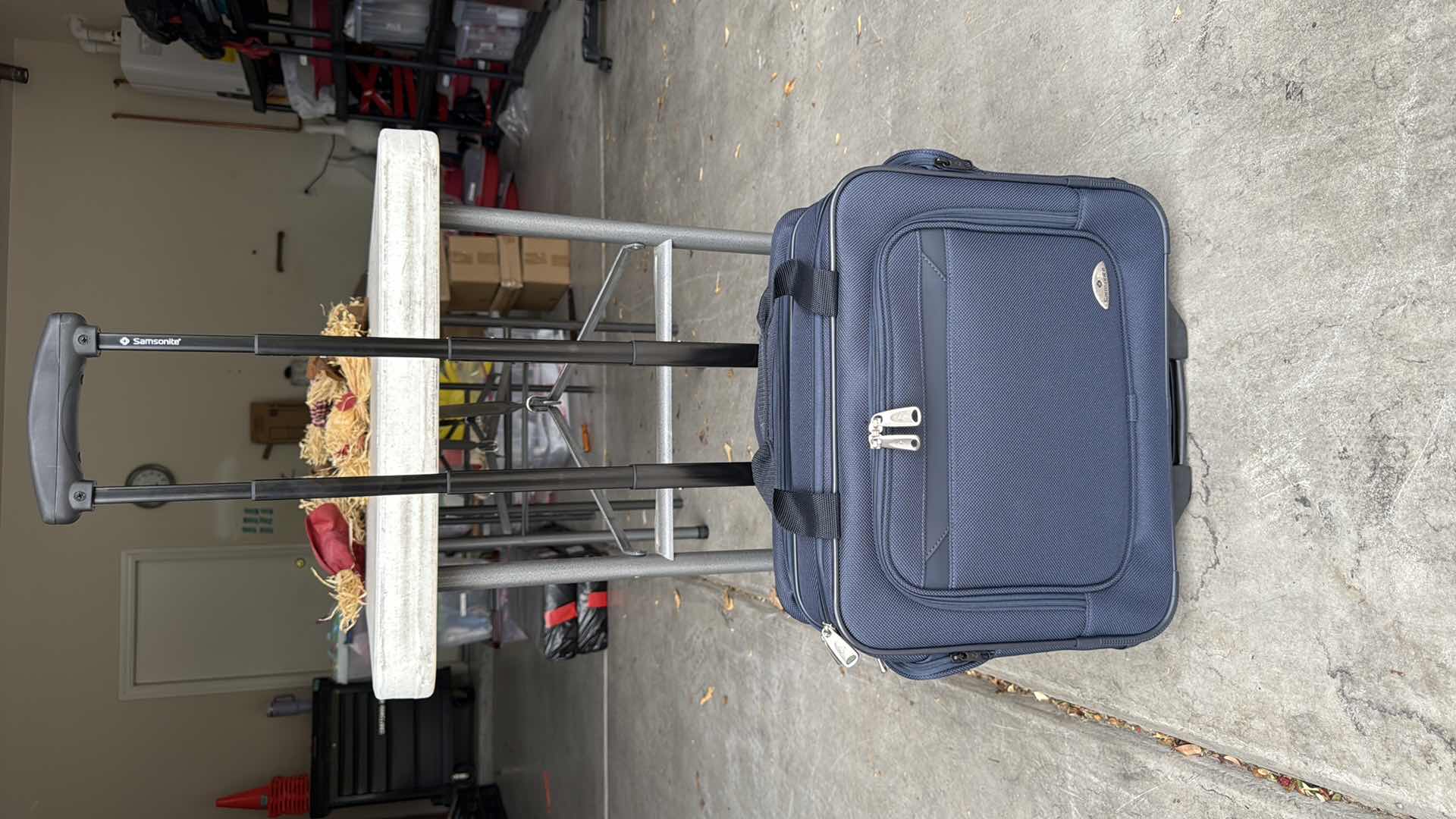 Photo 1 of SAMSONITE NAVY BLUE SOFTSIDE CARRY ON SPINNER W19” H16”
