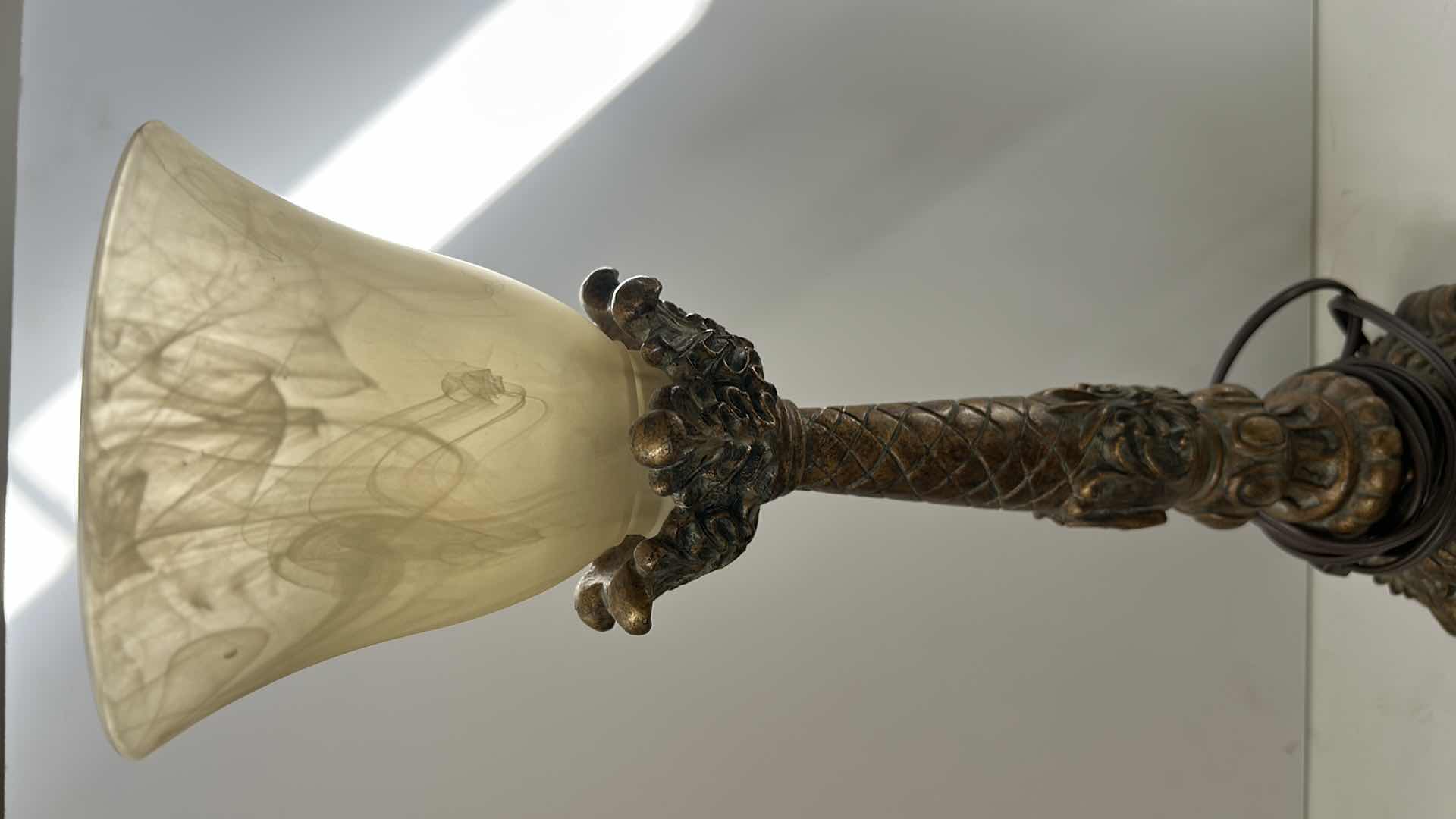 Photo 1 of GOLD TONE CERAMIC LAMP AND IVORY SWIRLED GLASS SHADE H19”